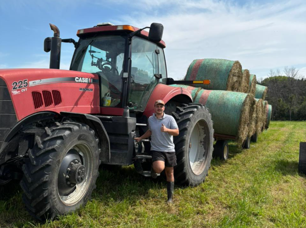 H-2A Program worker with tractor