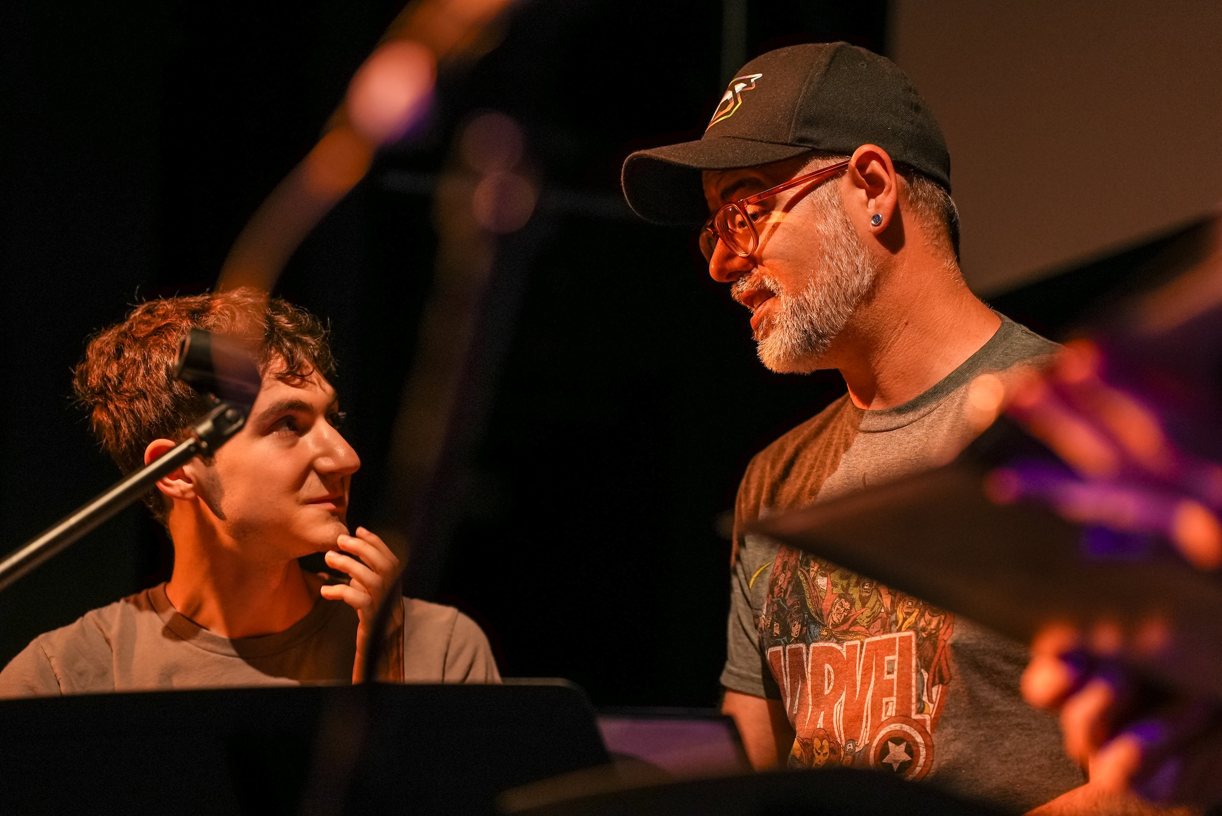 Actor and director going over stage notes with music stands