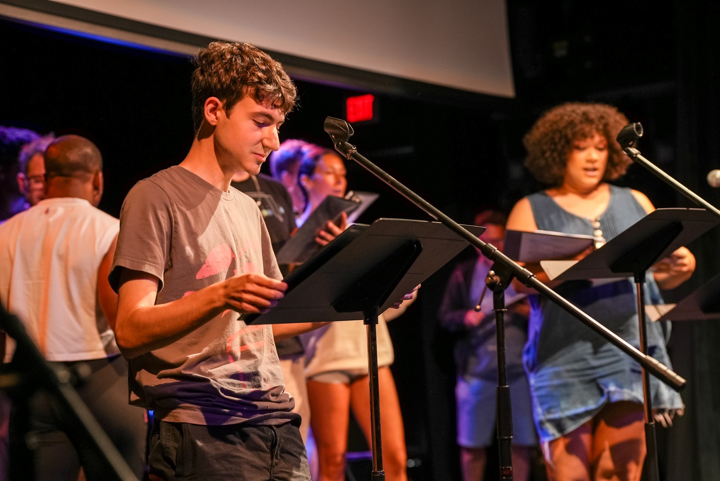 Actors rehearsing singing