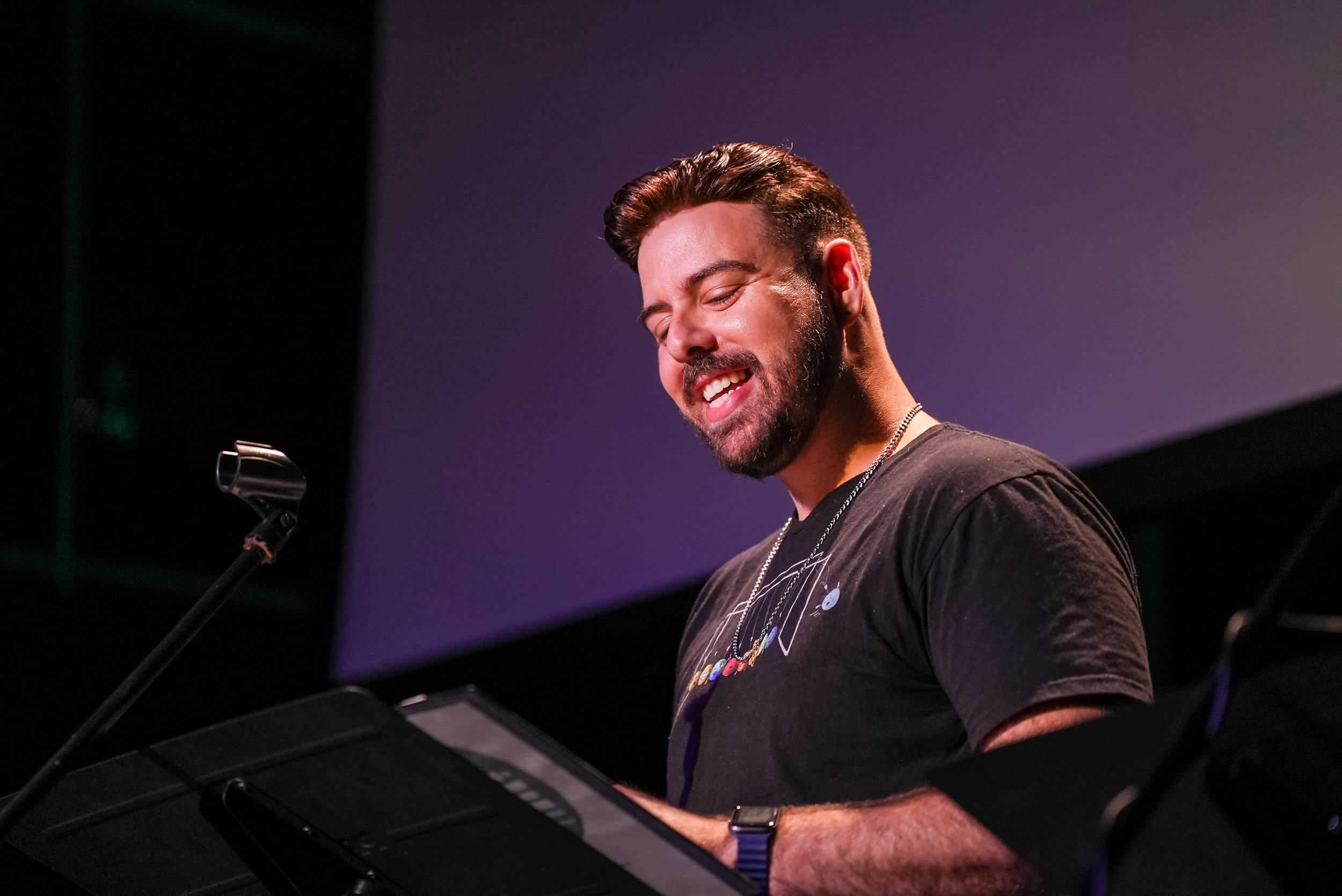 Actor singing on stage rehearsing
