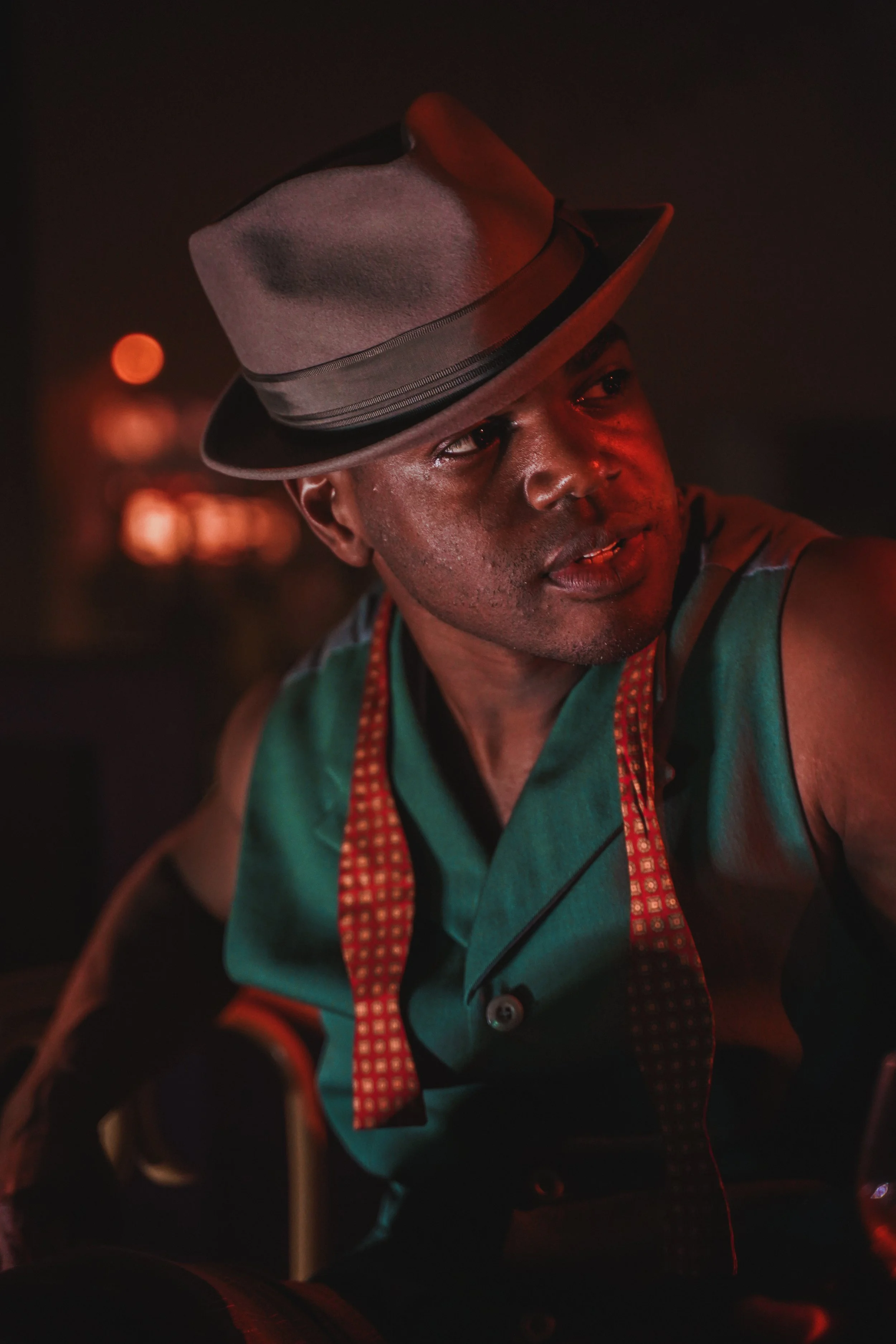 Lady Be Good Actor With Fedora Looking Away From Camera