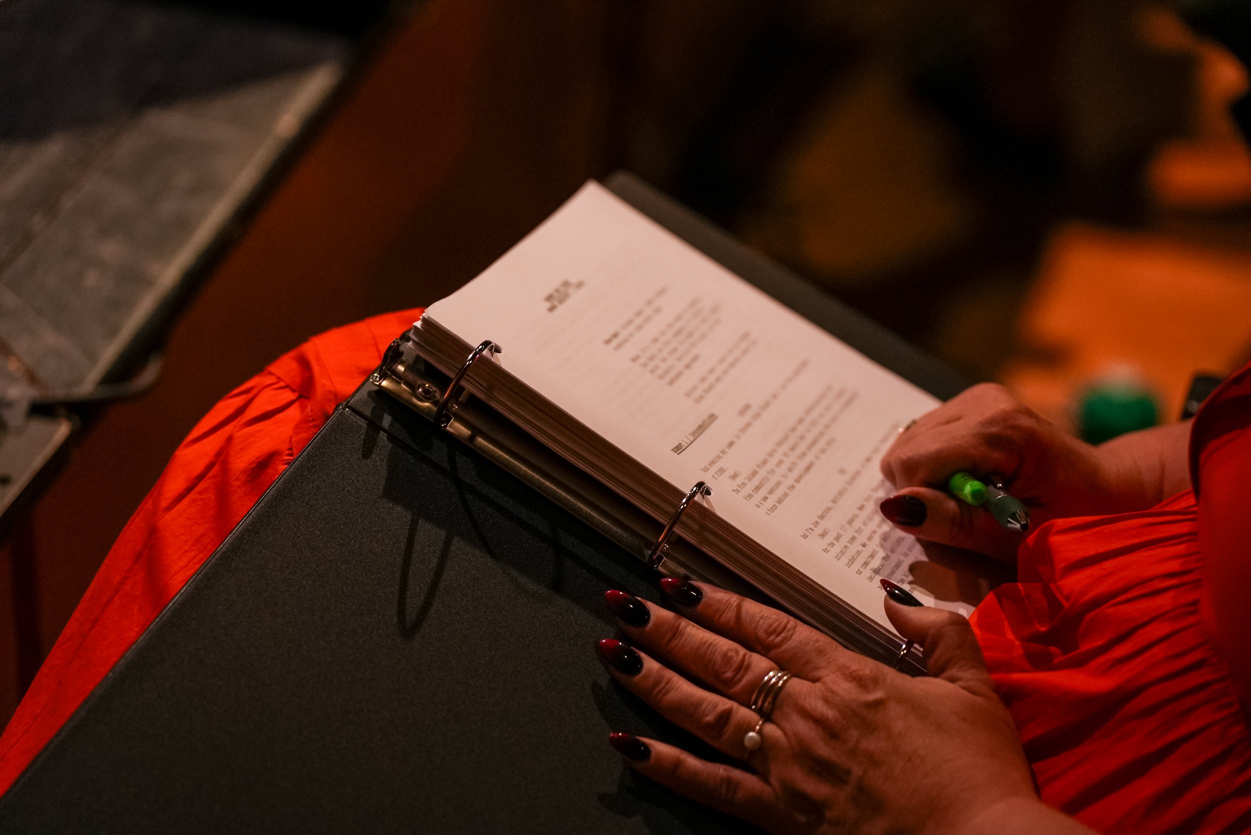 Production staff annotating the script of future production