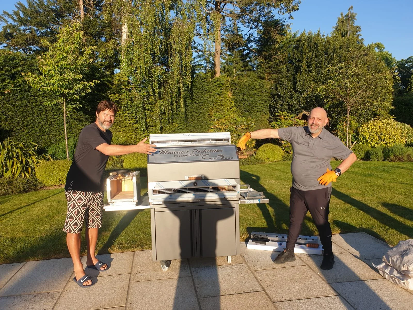 Mauricio Pochettino.  Stainless steel Argentine-style grill with adjustable cooking grate.