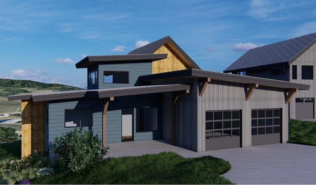 Modern two-story house with a flat roof and a garage, surrounded by green grass and hills, under a partly cloudy sky.