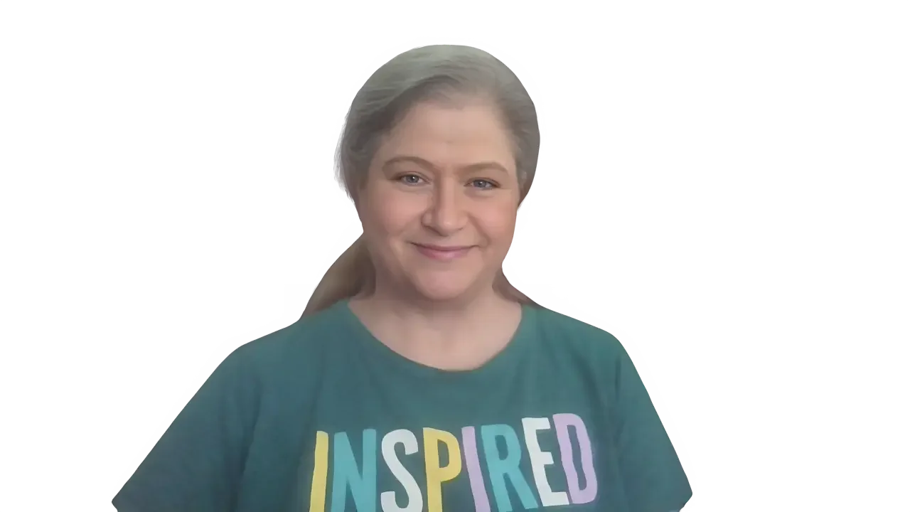 Michelle Robin Gould, LMHC, Florida Therapist, wears a shirt with colorful letters spelling  INSPIRED.