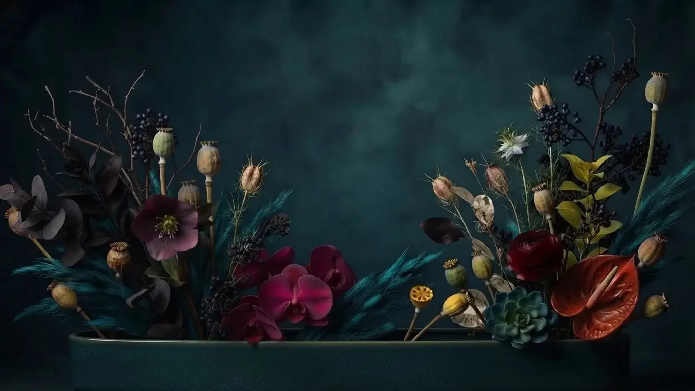 Colorful orchids, anthuriums, and textured foliage arranged in a long, shallow ceramic planter against a dark teal background.