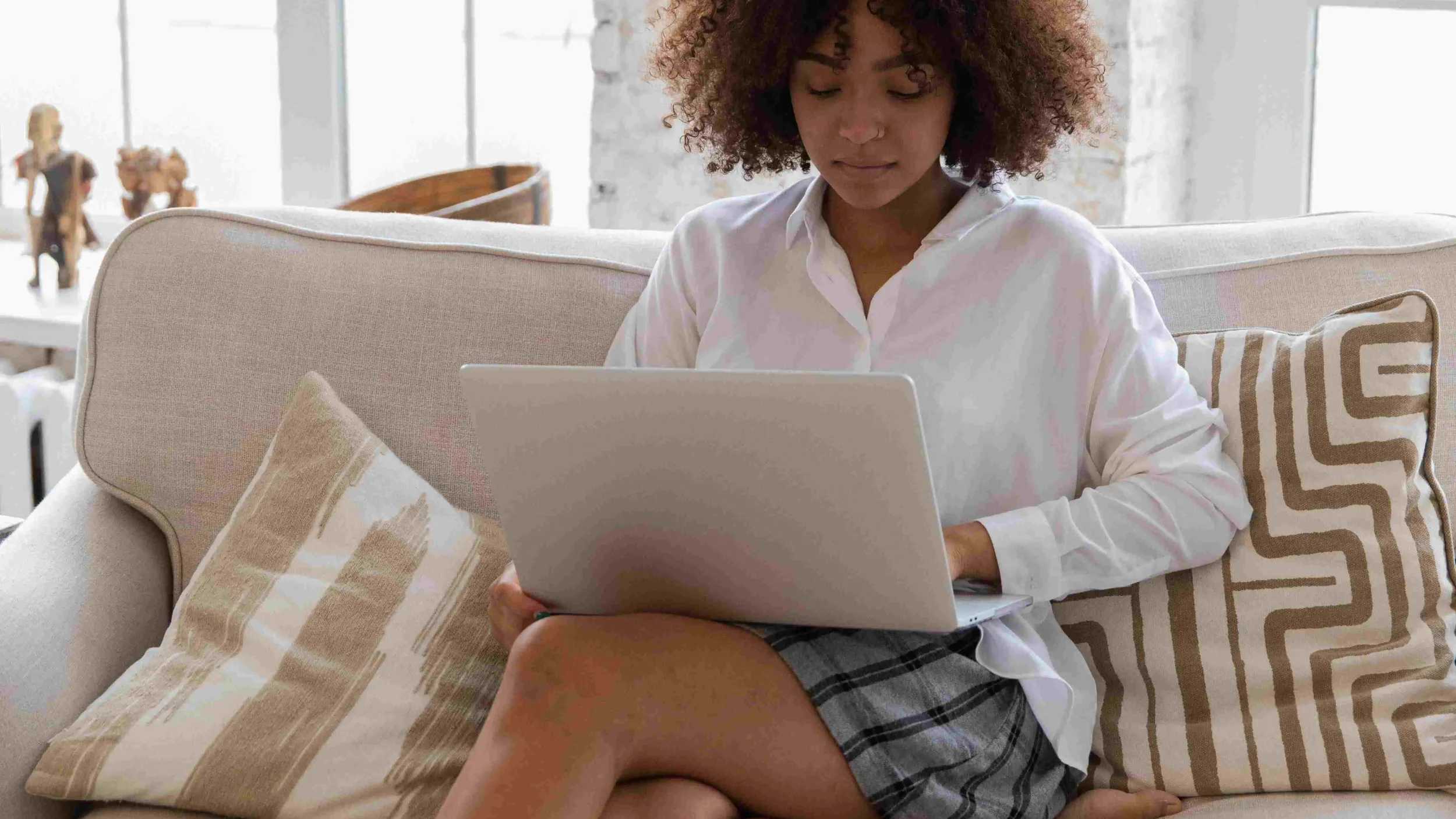 A professional Black woman looks for online therapy for personal growth in Greenacres, Florida.