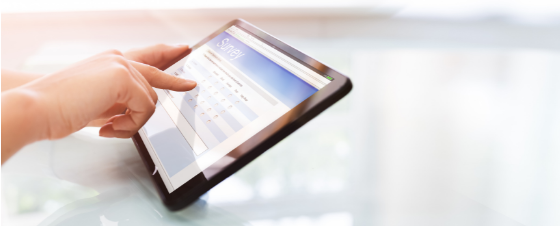A person fills out an online form on a tablet in preparation for therapy in Florida
