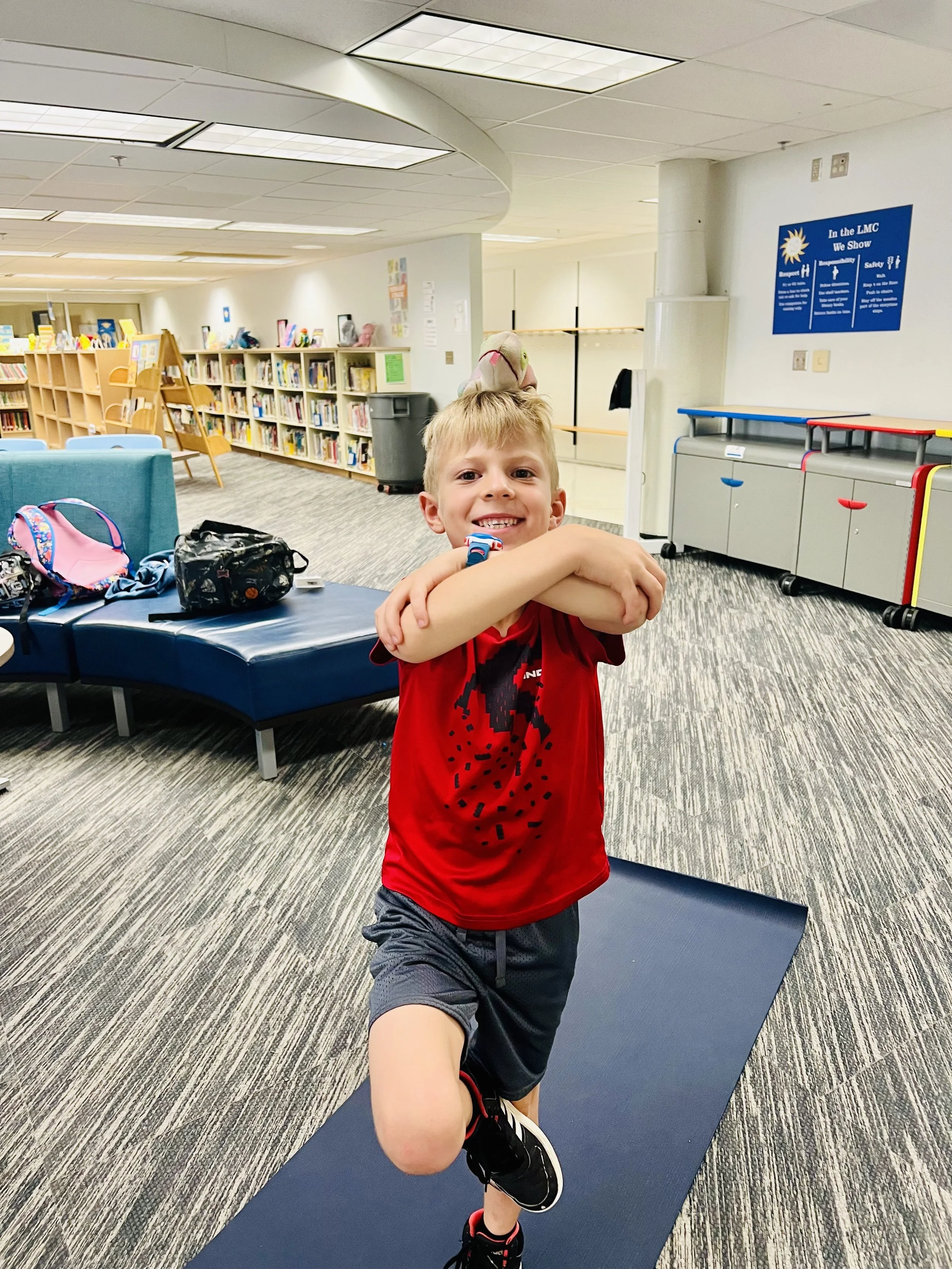 Child practicing focus and breathing during kids yoga class in Roseville MN