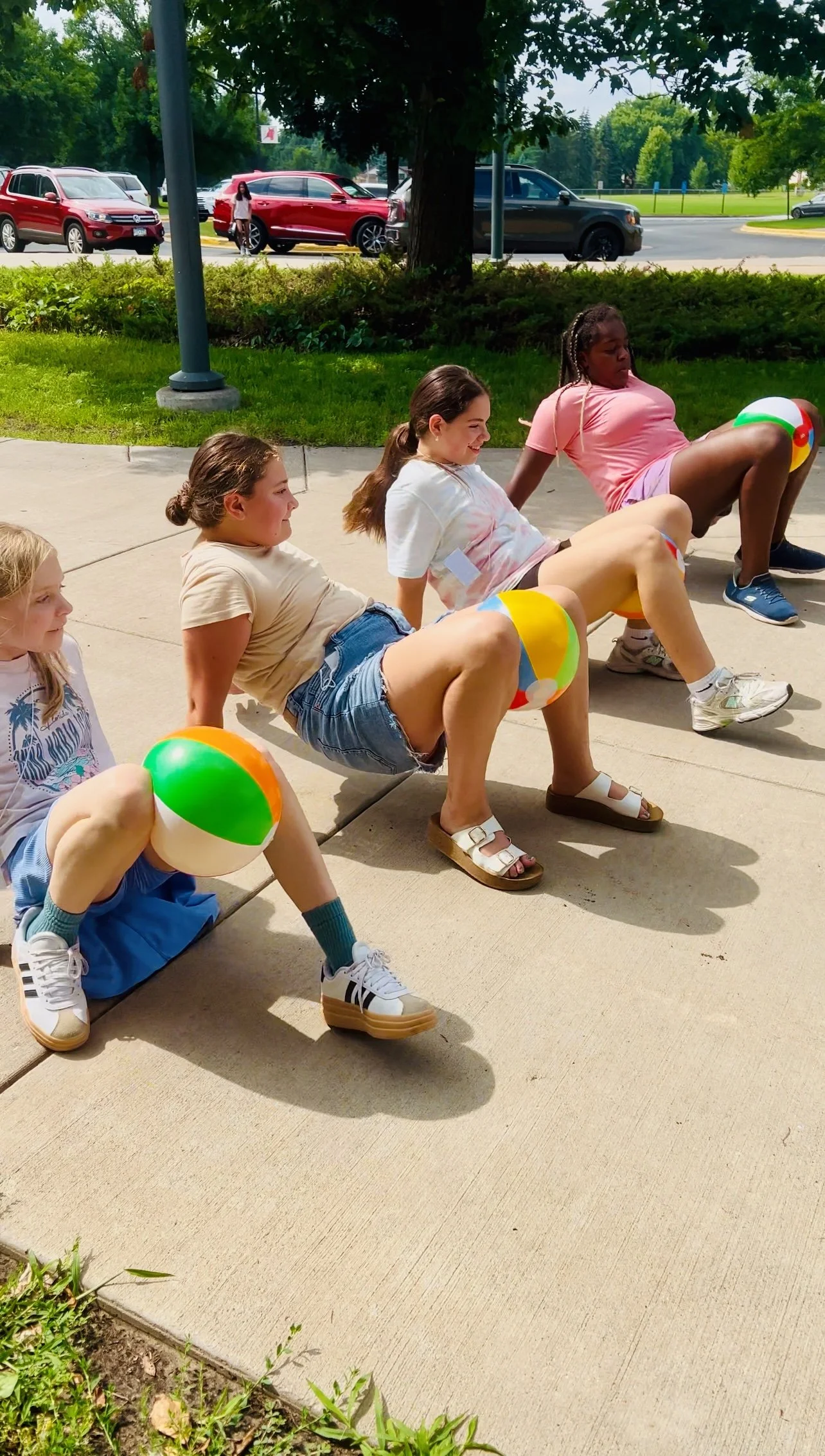 Elementary students playing a mindful movement beach ball game during a Mounds View Community Education summer camp in Minnesota.