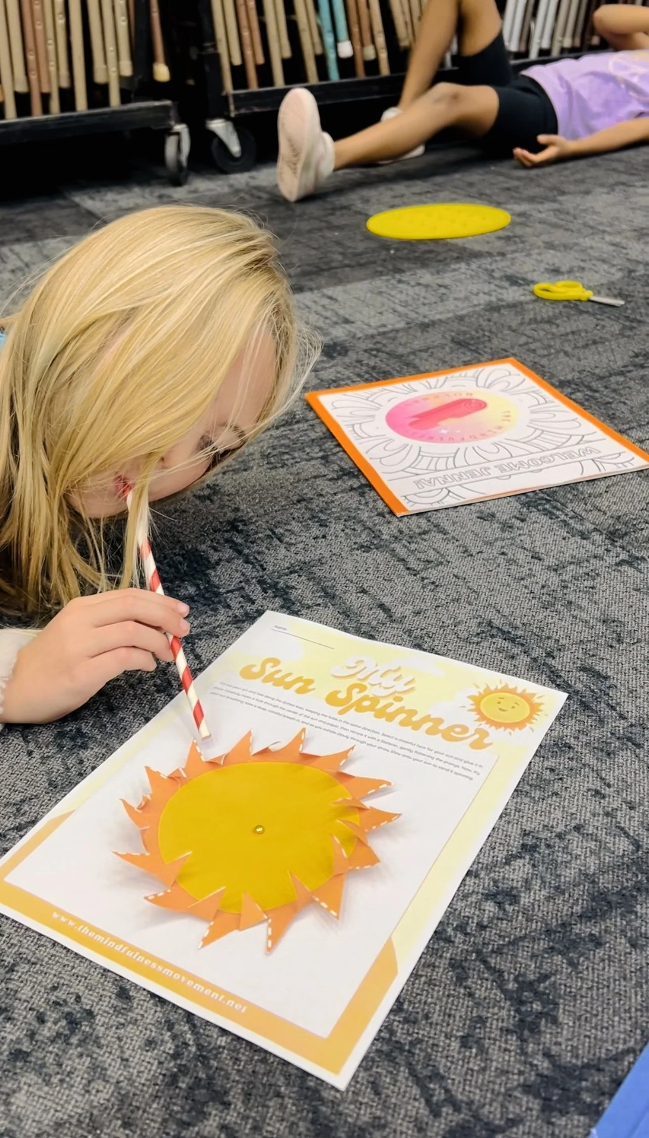 Child focused on calming mindfulness craft project in Roseville kids enrichment program