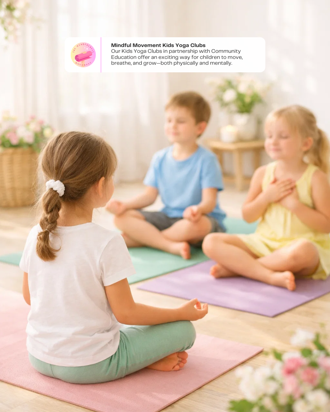 Kids practicing yoga sitting in easy pose on their mats, smiling and feeling calm during a kids yoga and mindfulness class