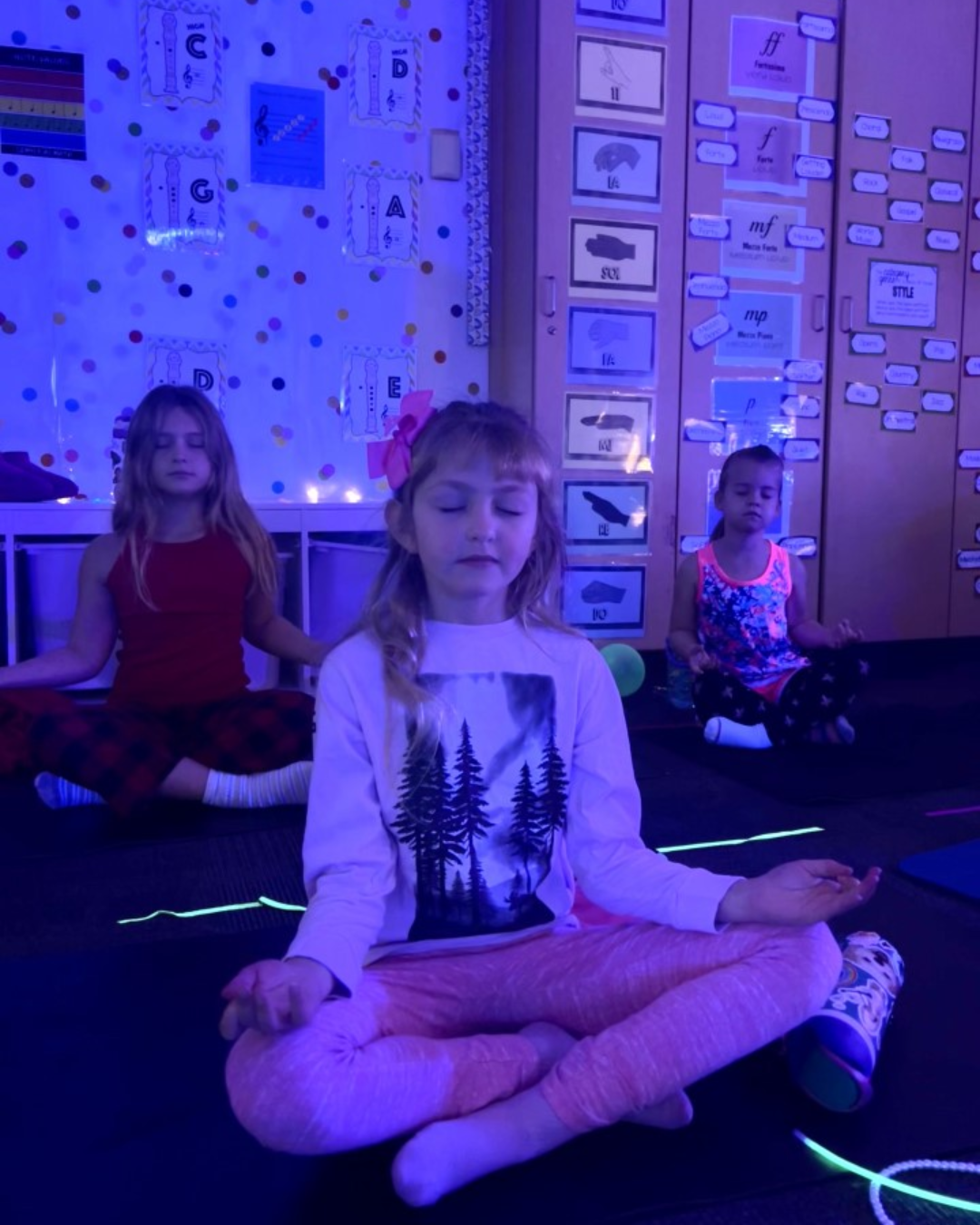 Children practicing guided meditation and yoga during a kids mindfulness retreat in Minnesota.