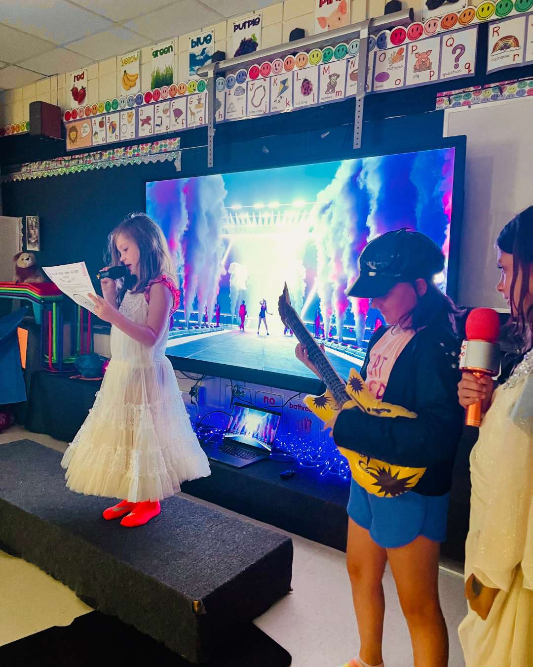 Girl singing confidently during Pop Star-themed creative movement summer camp in Roseville Minnesota.