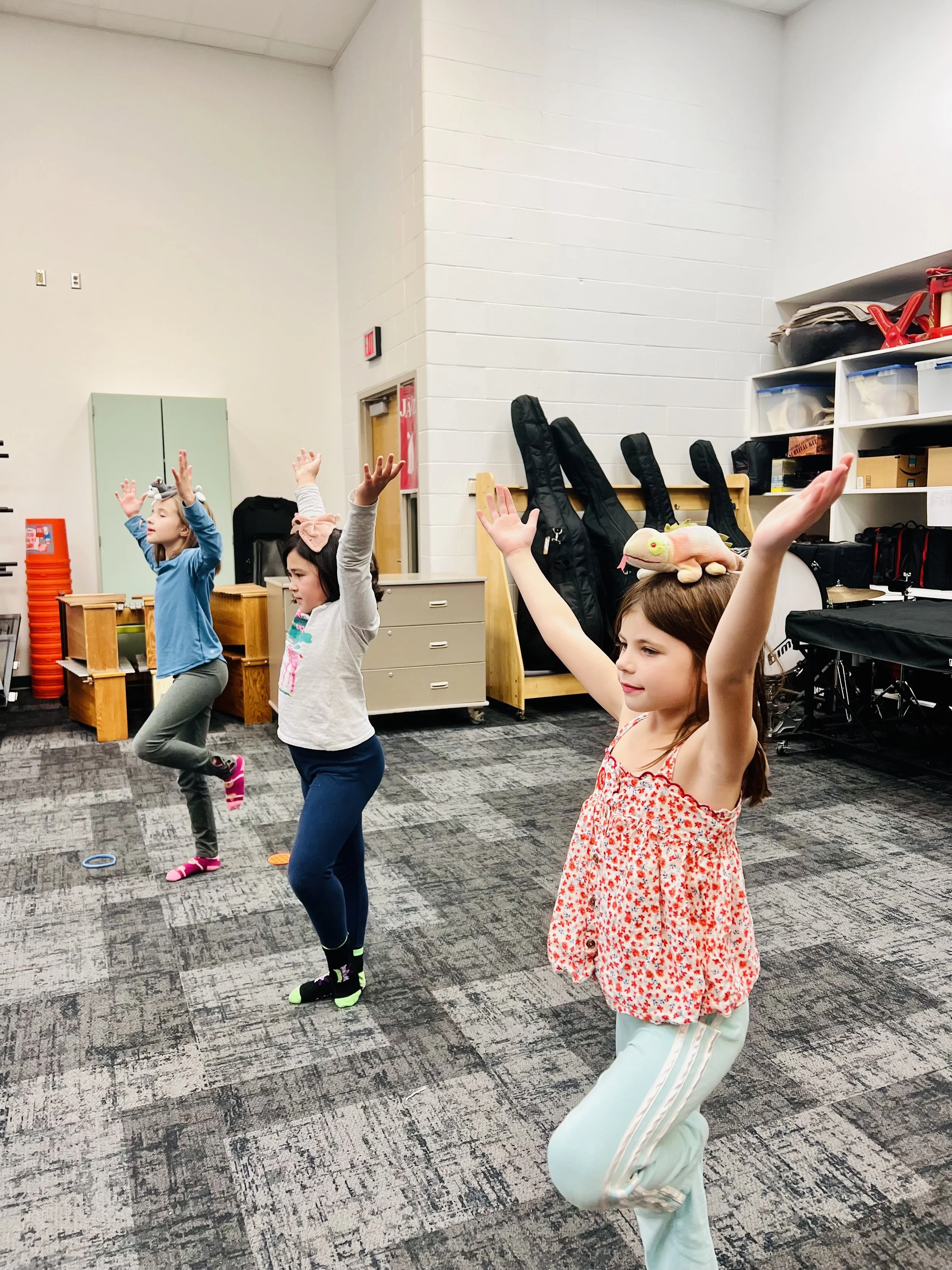 Happy child building confidence in Roseville MN after school yoga and mindfulness class