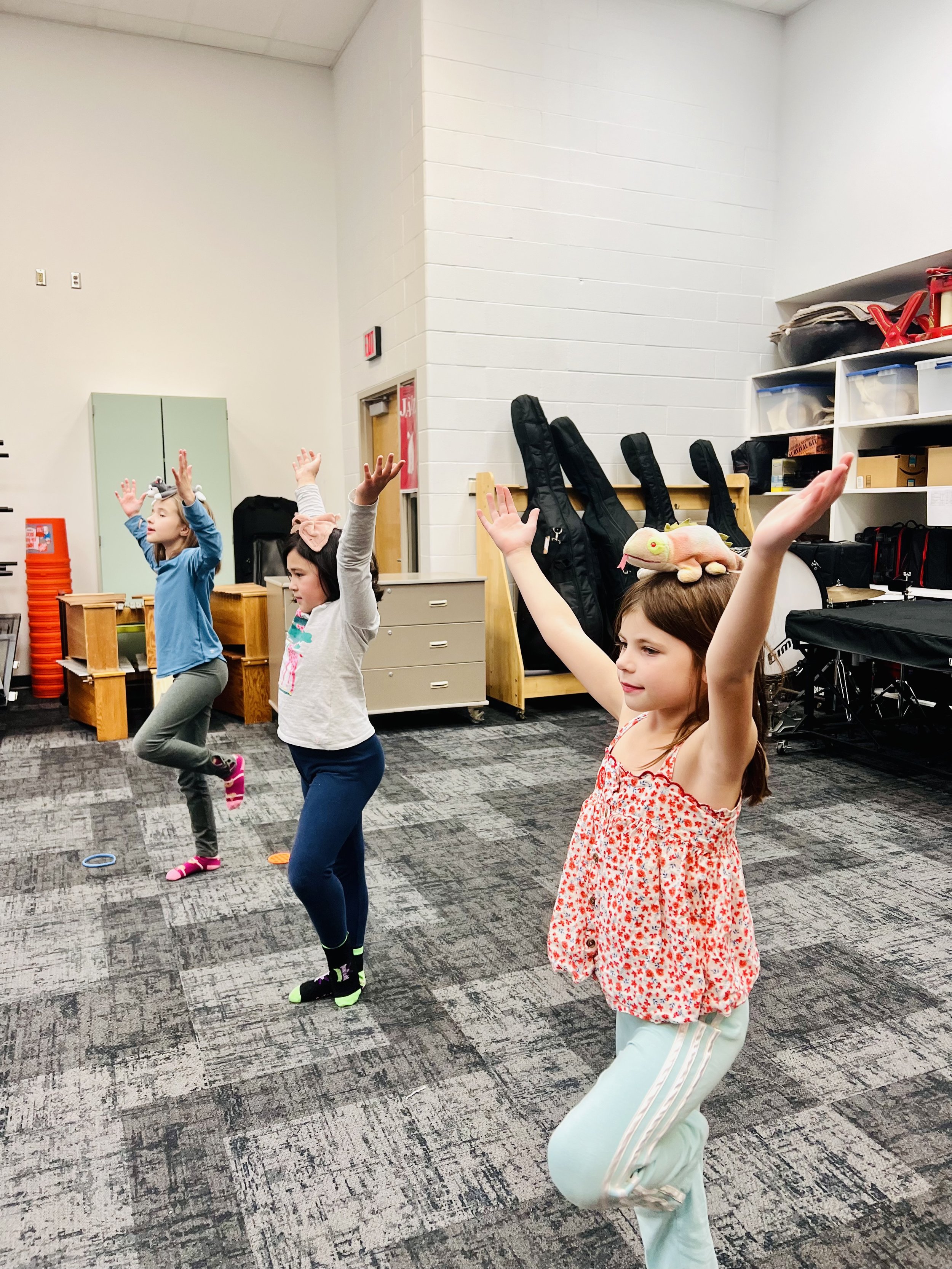 Children practicing balance and movement in a kids yoga and mindfulness class in Mounds View MN after school program