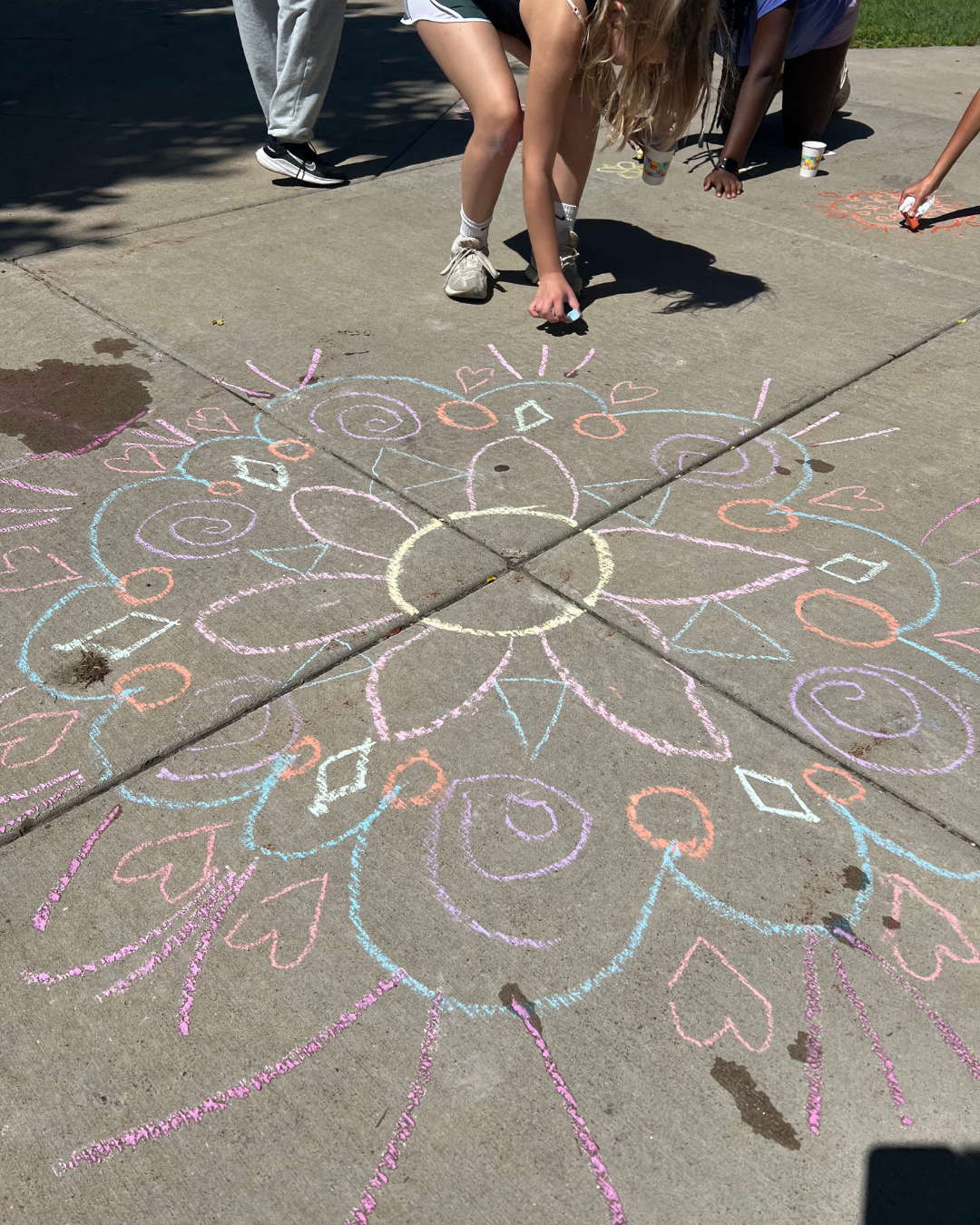 Chalk art on sidewalk promoting Summer 2026 Community Education kids and middle school camps in Mounds View, Roseville, and New Brighton Minnesota.