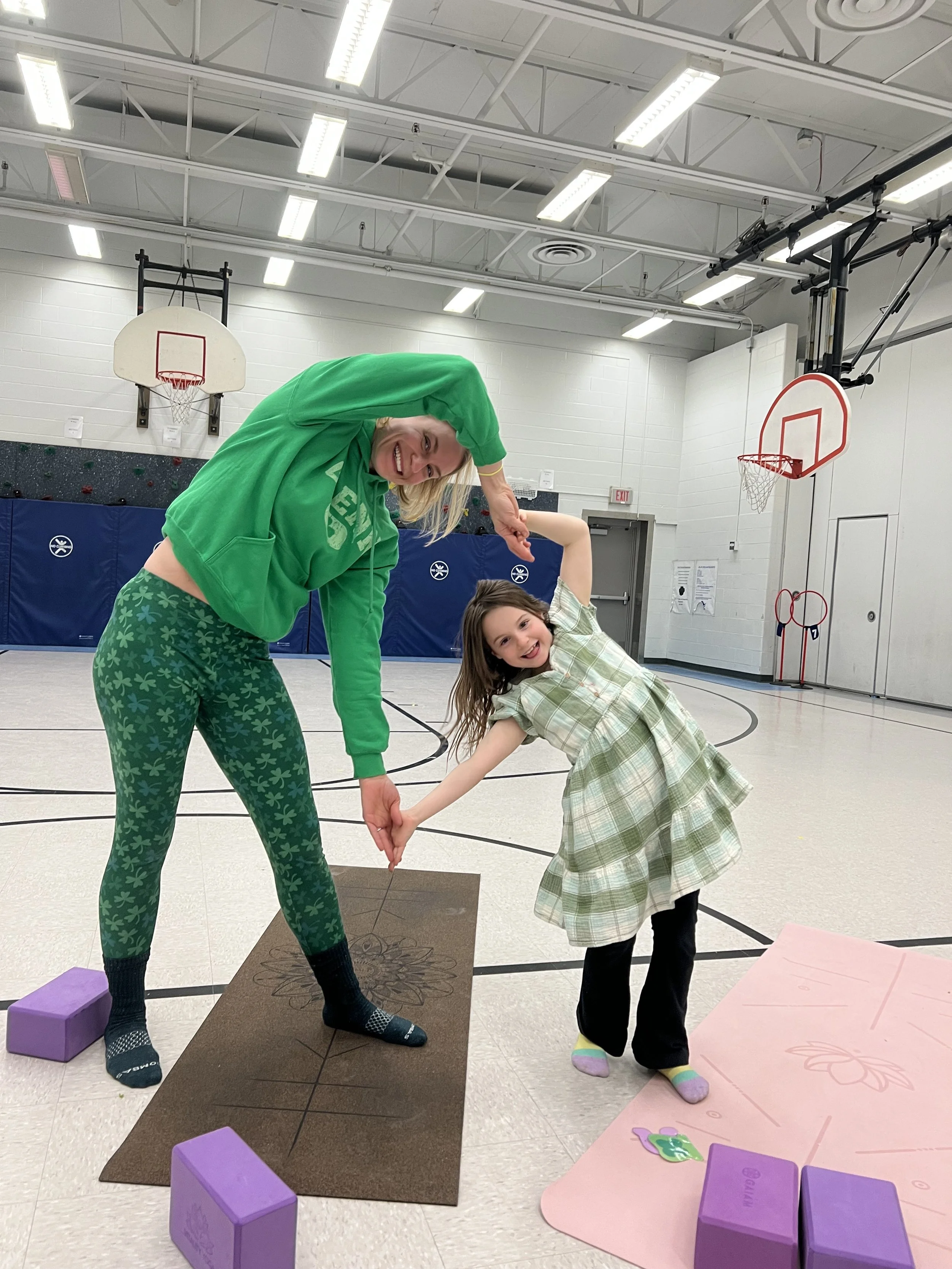 Minnesota family yoga class — parents and kids bonding on the mat.