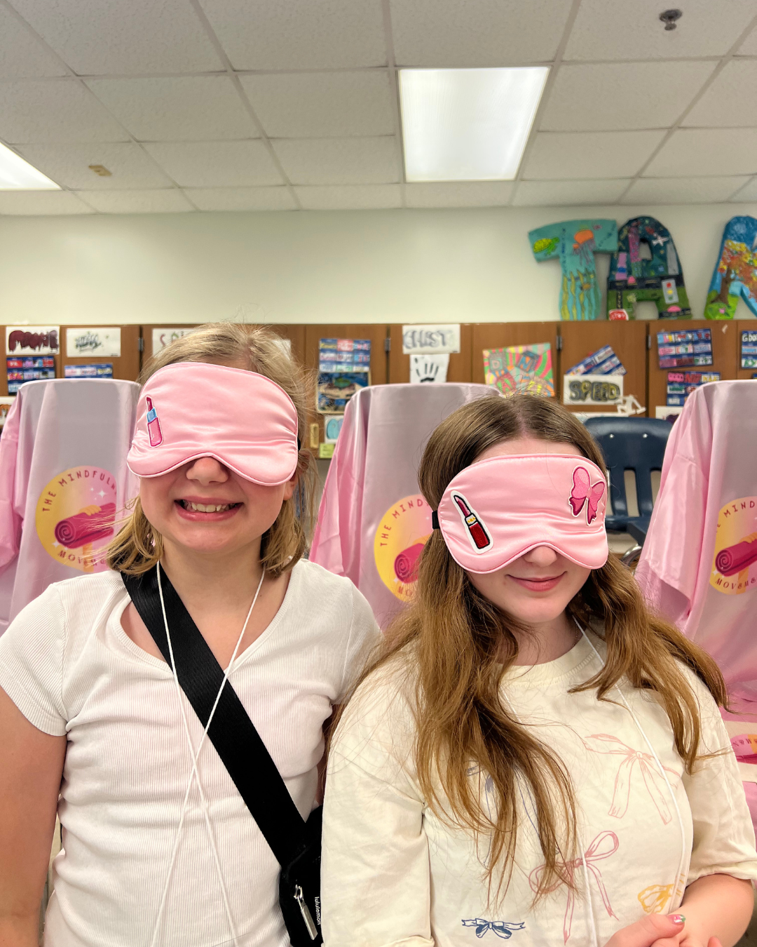 Middle school girls wearing handmade sleep masks created during mindfulness and self-care enrichment program in Mounds View Minnesota