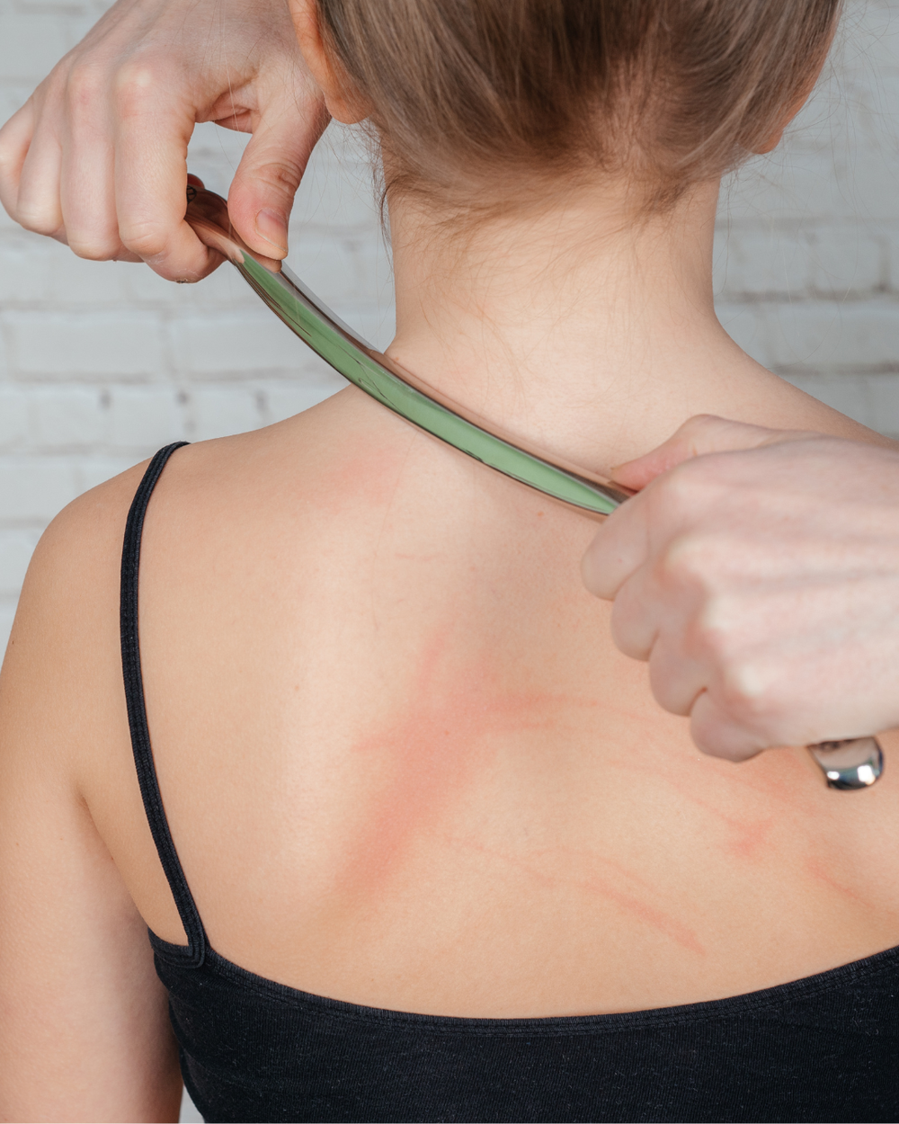 Instrument-assisted scraping to release tight soft tissue