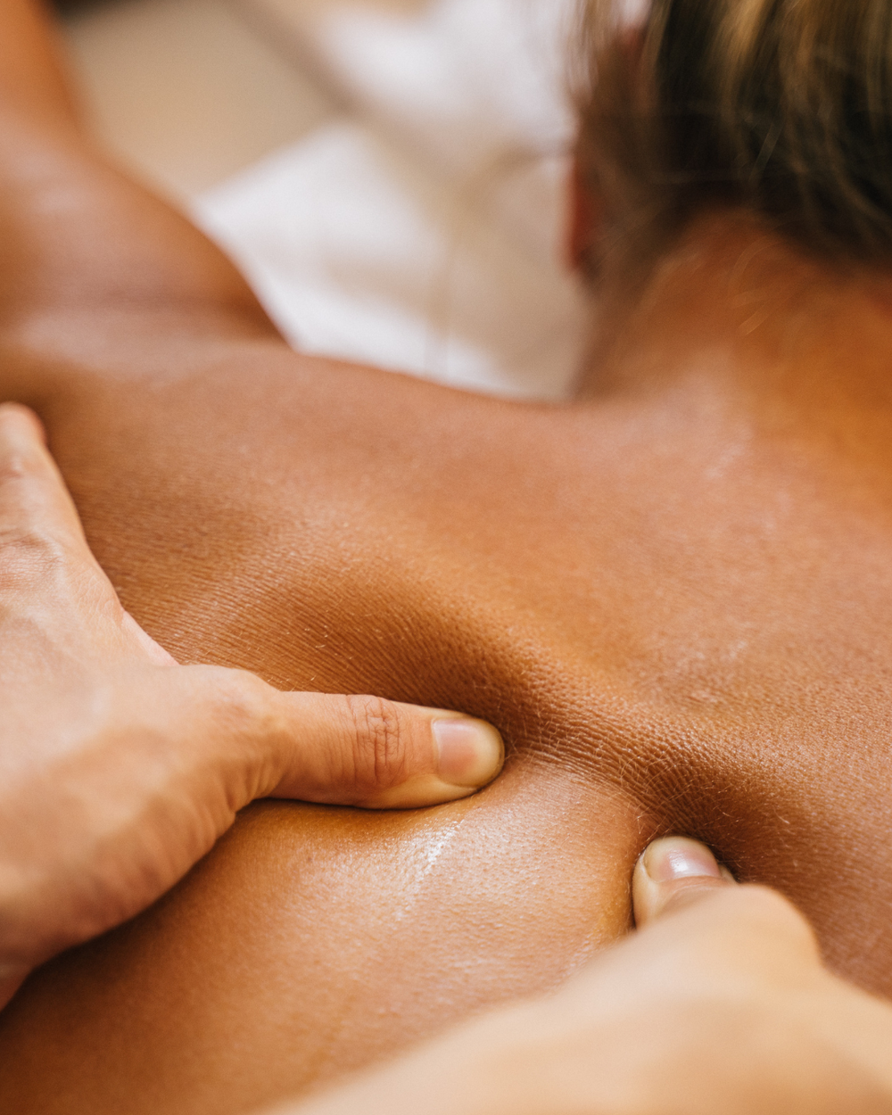 Deep manual massage to release tight muscles at The Well Chiropractic