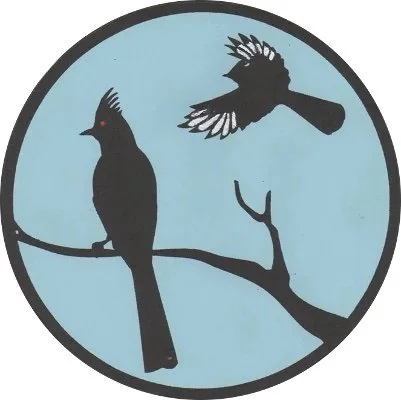 A circular logo featuring two black birds on a branch, one perched and the other flying above, against a light blue background.