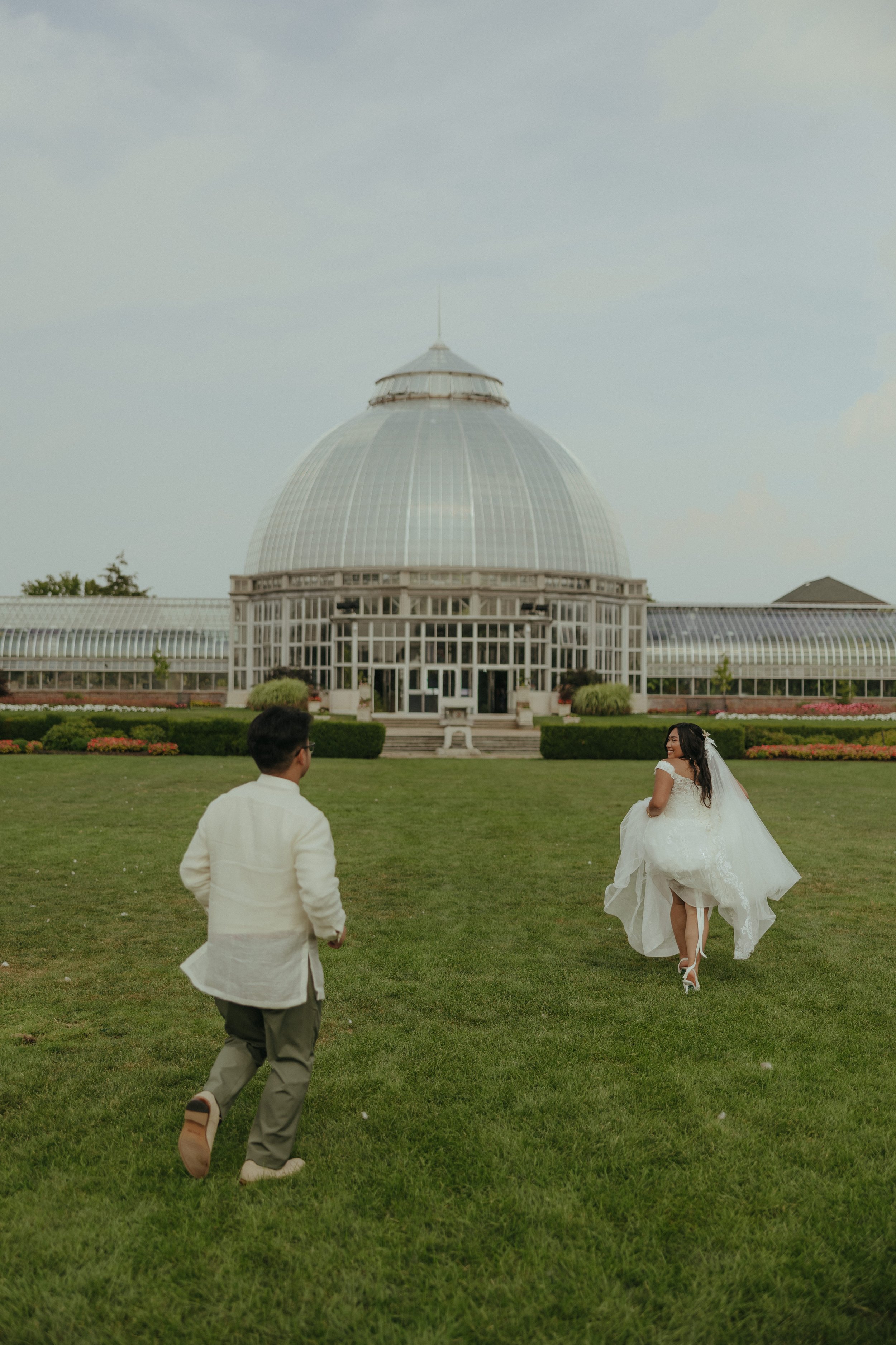 Couple frolicking through at Belle Isle Gardens, Detroit
