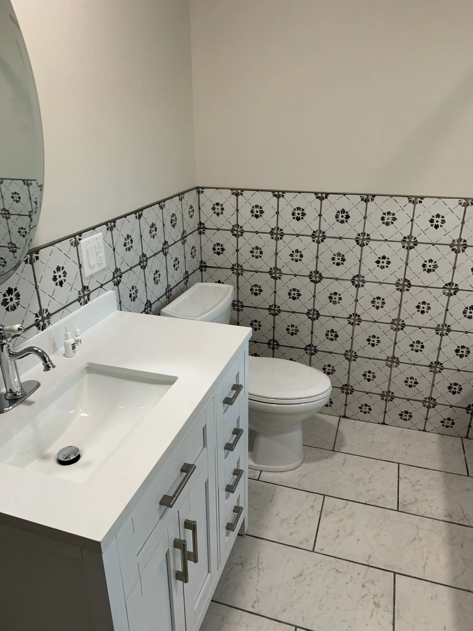 Tile, sink, and toliet