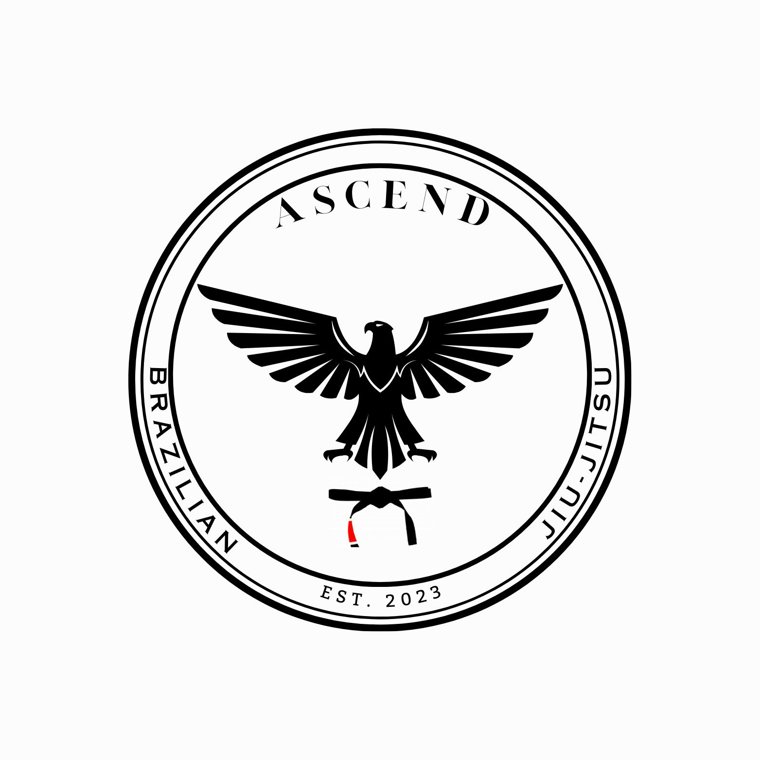 A circular logo with a black eagle at the center, wings spread wide. The logo contains words "ASCEND" at the top, and "BRAZILIAN JIU-JITSU" around the bottom edge. It also states "EST. 2023" at the bottom, with a small red and black belt below the ea