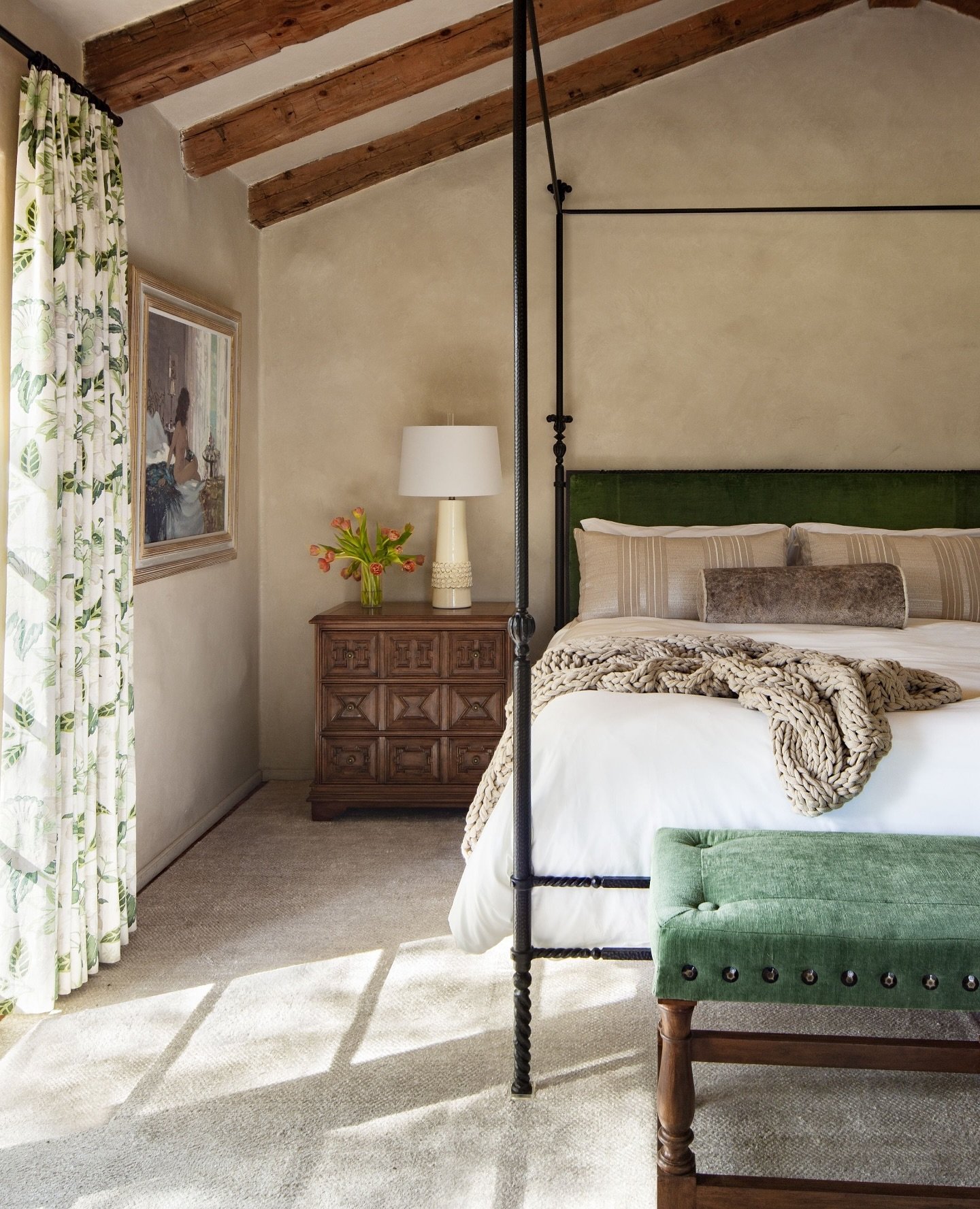 The Primary Bedroom at Rancho Arroyo Perdido feels like spring. Filled with light, layers of materials, and richly lush. A steel canopy bed grounds the space, while intricate details like the carved nightstands and soft window coverings make it deepl