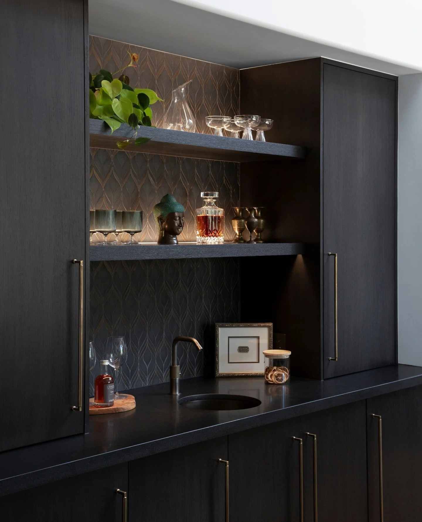 ⁠A dramatic and moody bar at our Casa J&rsquo;s project. Just the right size to include a hidden beverage refrigerator, ice maker, and storage for liquor and glasses. Everything tidy and unseen, yet a perfectly functional little space for entertainin