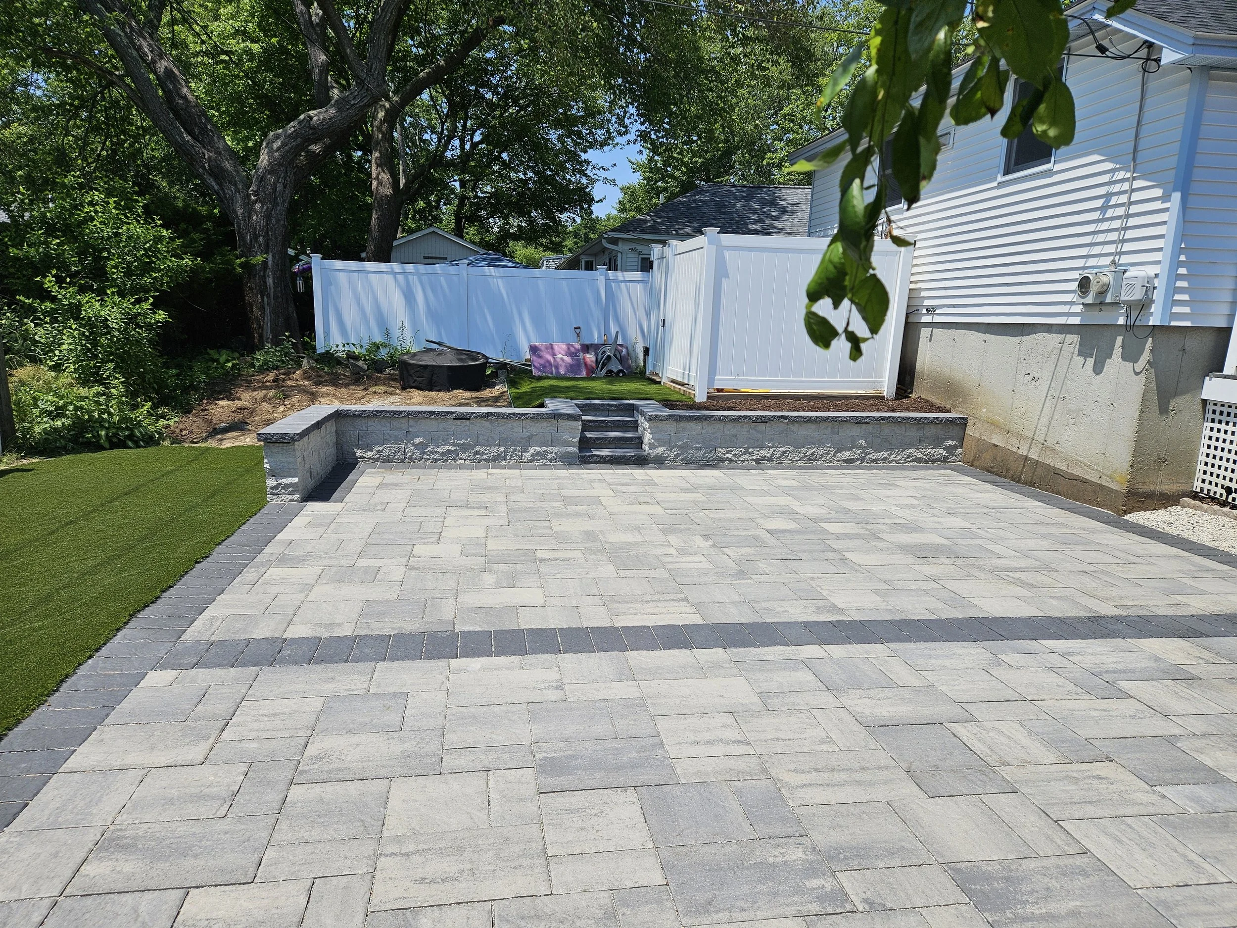 Yard patio with border leaves plenty of room for family gatherings.