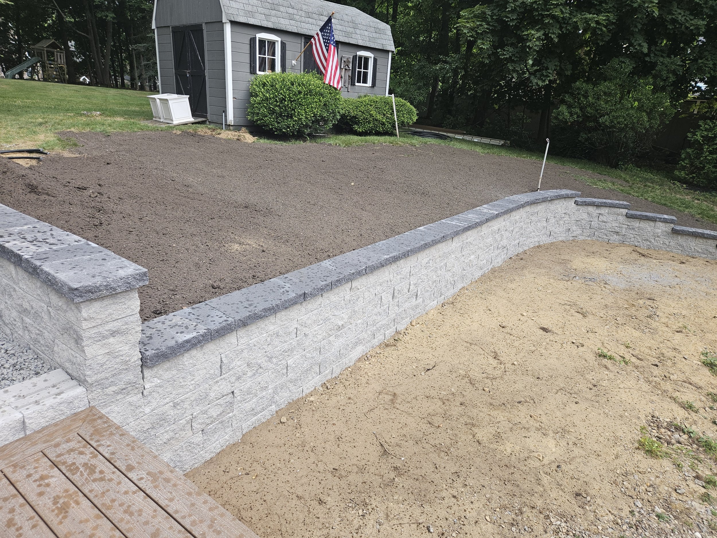 Sloped yard was terraced with a retaining wall
