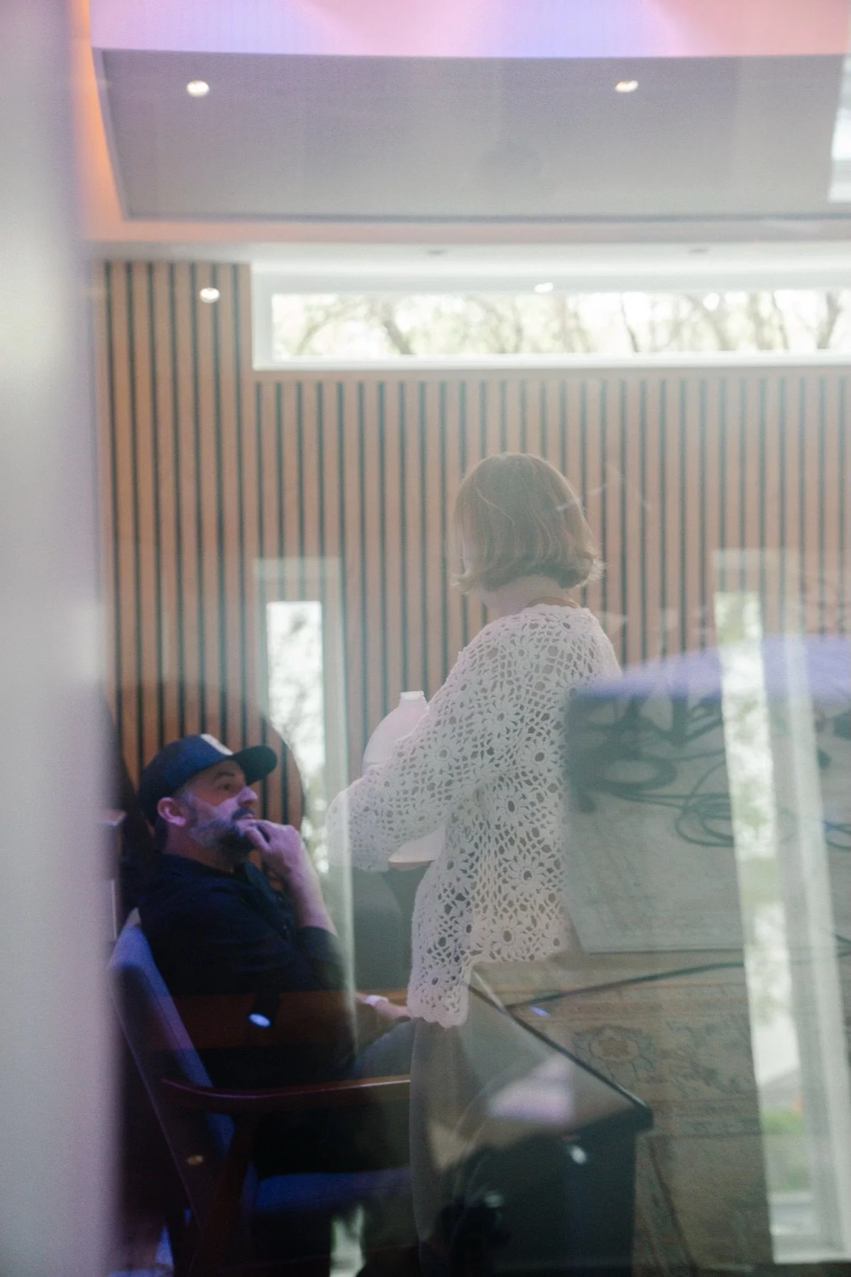 Jeremy listening and working with an artist in the recording studio