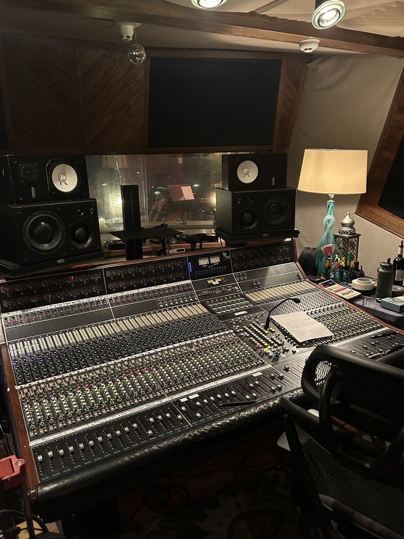 A recording studio control room and mixing console
