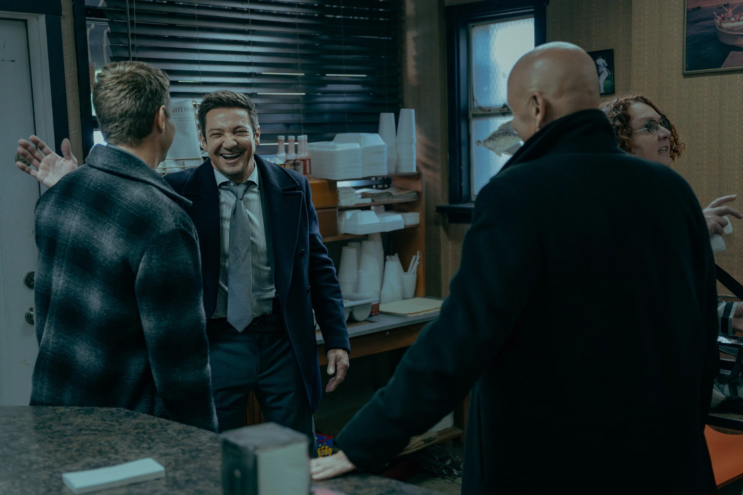 Jeremy Renner as Mike McLusky Taylor Handley as Kyle McLusky and Hugh Dillon as Ian on the set of Mayor of Kingstown episode 9
© Viacom International