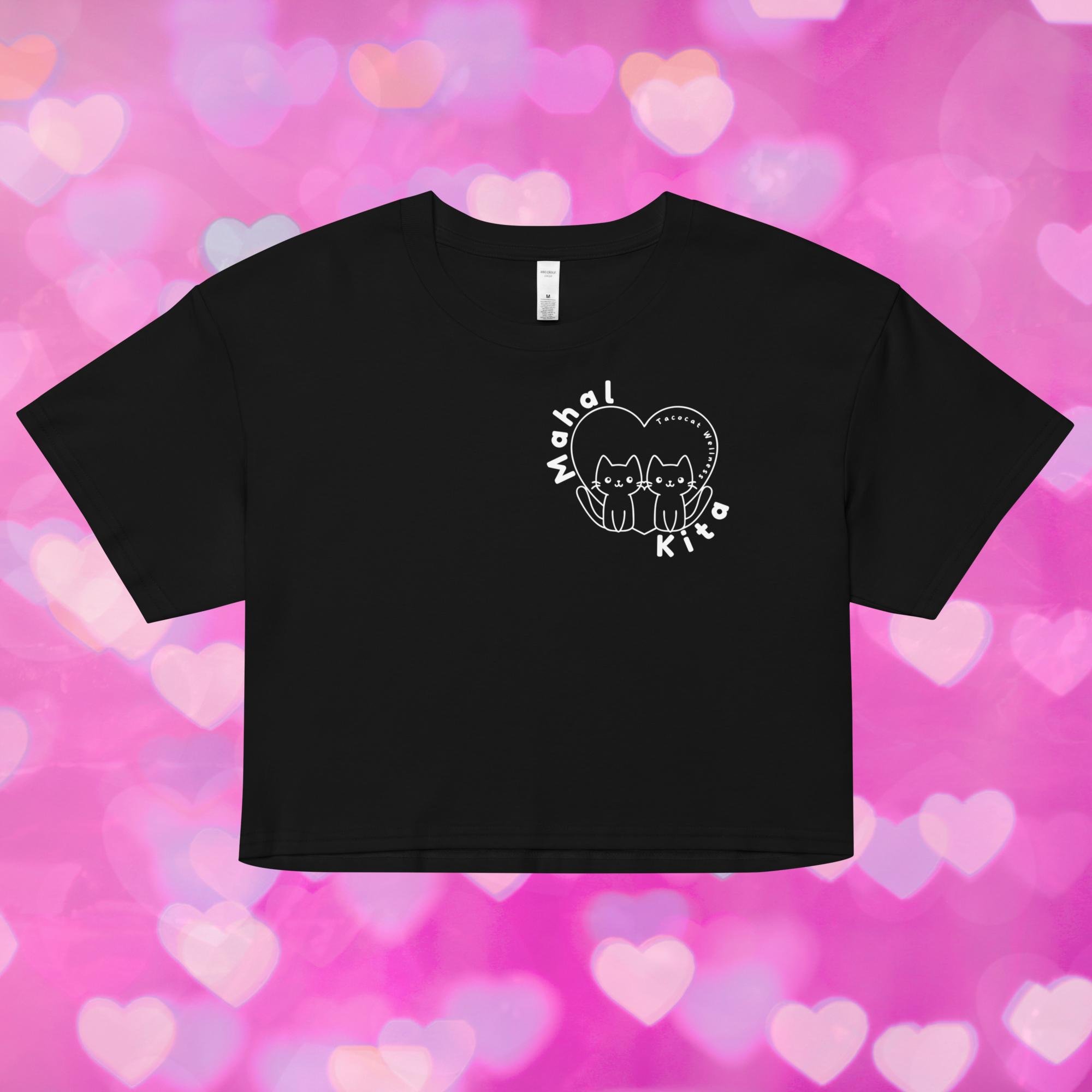 A relaxed-fit crop top featuring a cute illustrated cat and the words “Mahal Kita” in playful Tagalog script. Design is centered on the chest.