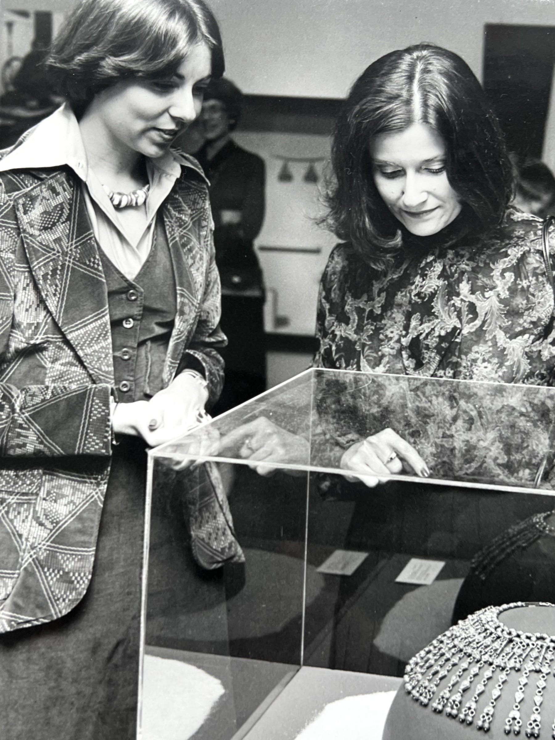 Alice Greenwald and colleague looking into a display case at the Spertus Museum of Judaica, Chicago.