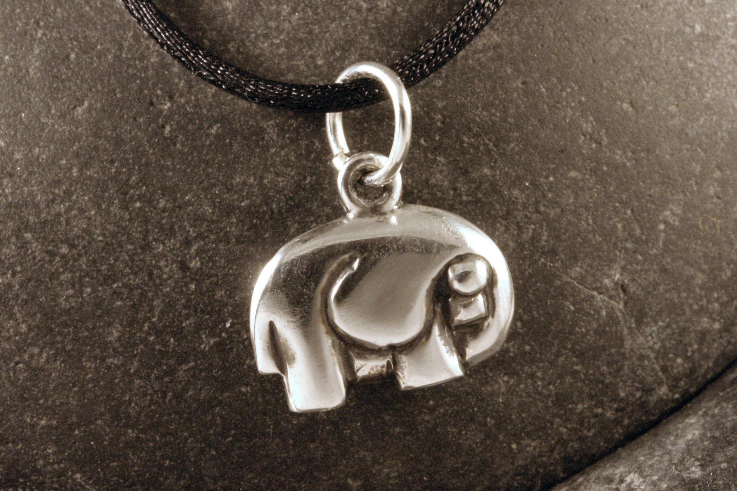 An oxidized sterling silver artsy good luck elephant charm.