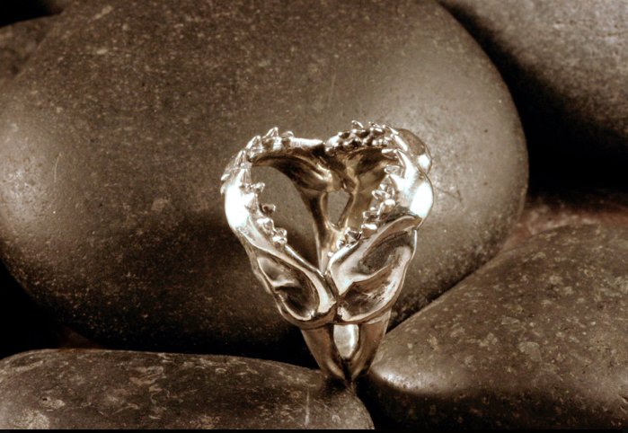 A side view of a sterling silver great white shark jaw ring.