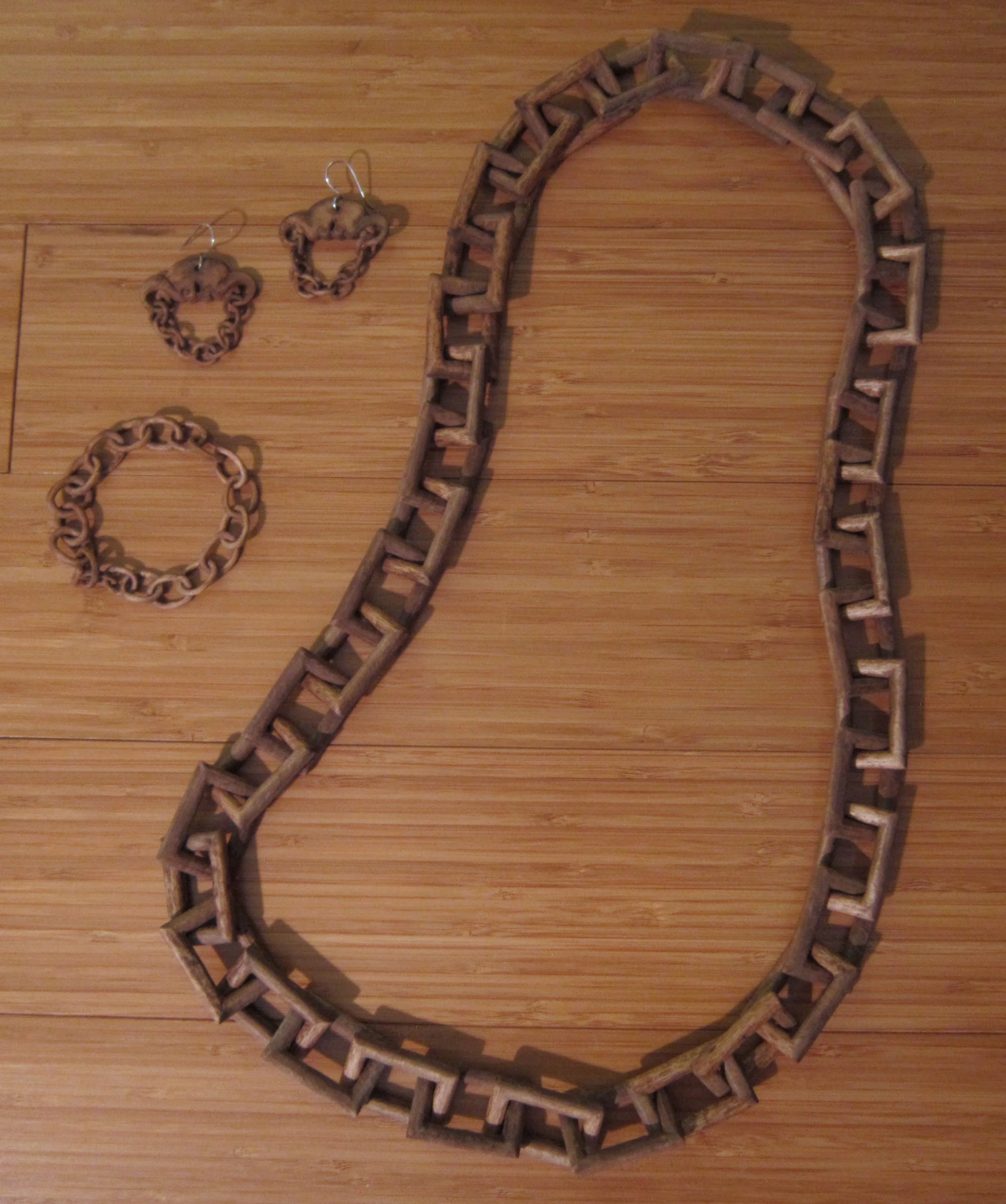 Limited wood jewelry series with hand carved wood chain bracelet, necklace, & earrings.