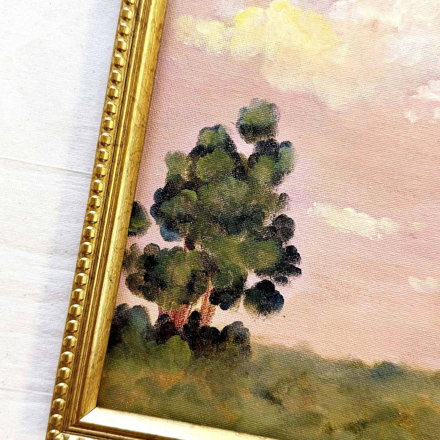Old World Romantic style landscape painting with soft pink sky.