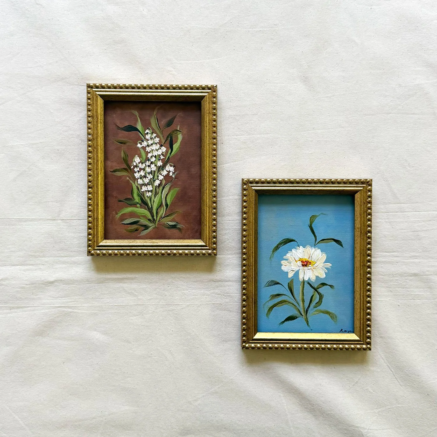 5x7 framed original botanical canvas artwork of white lily of the valley flowers.