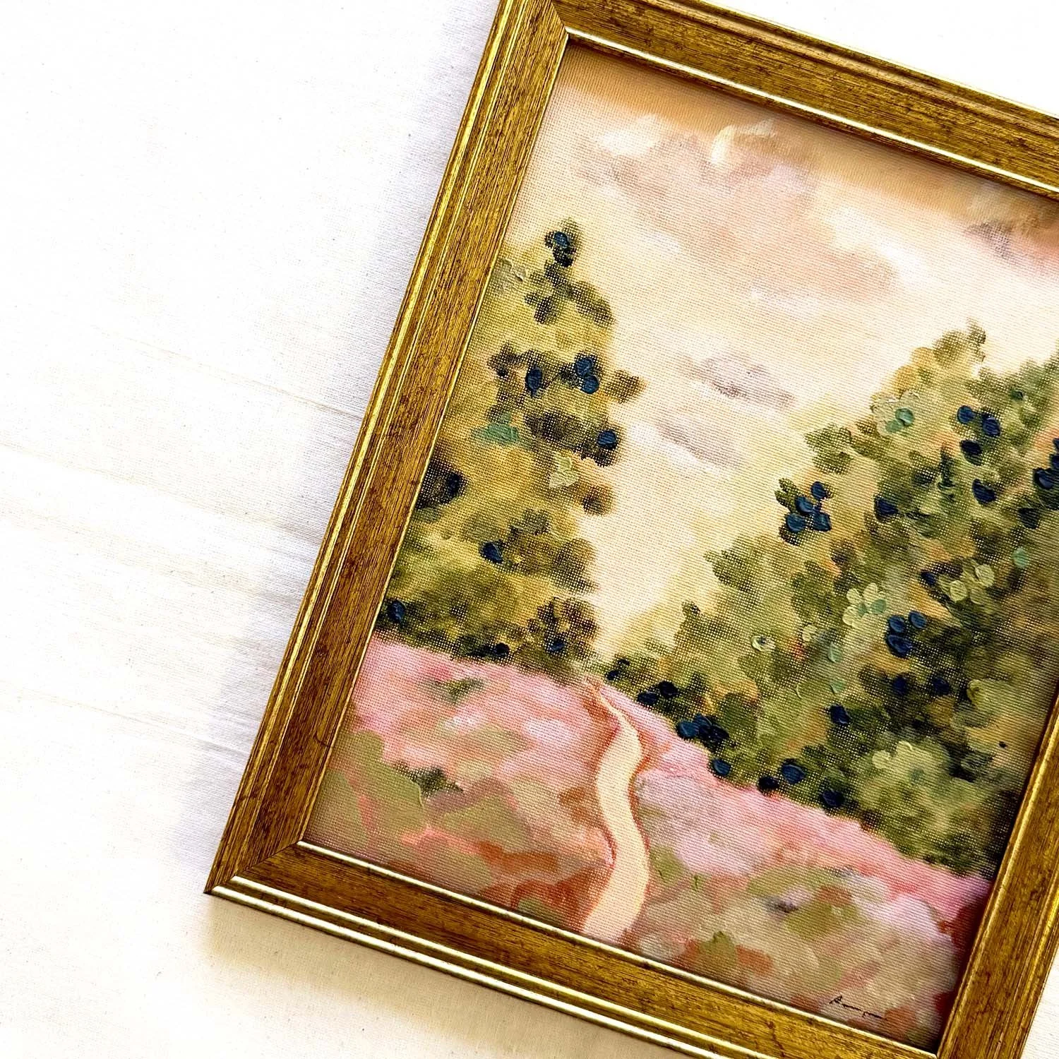 Framed fine art painting of a winding path through flowering bushes.
