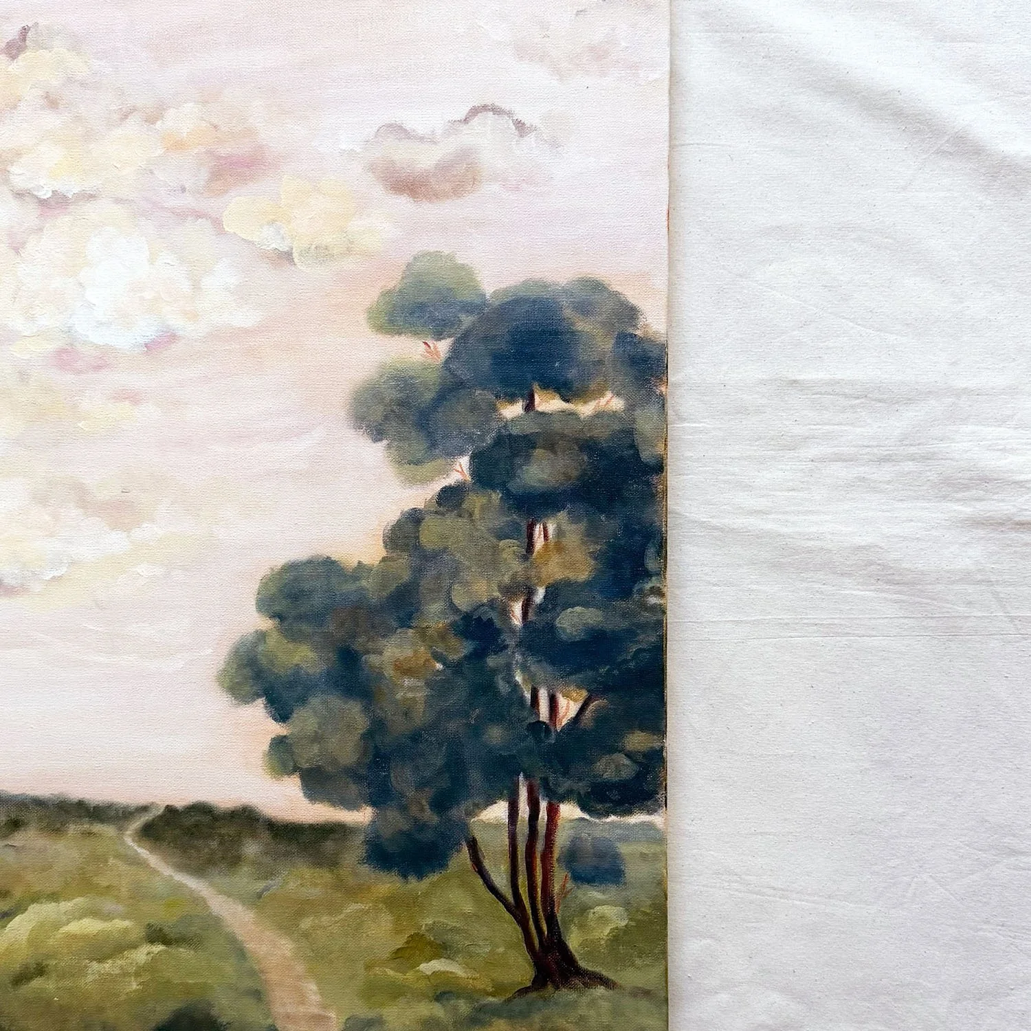 Old World romantic painting with soft cream clouds, sage green hills, and a field path.