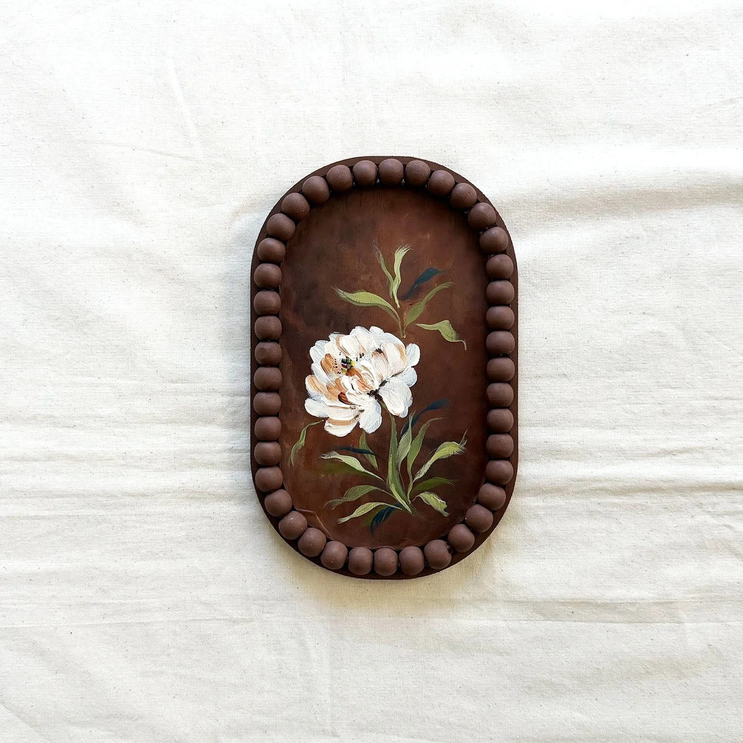 Small 5x7 white textured flower painting, part of a moody floral diptych by Ramya Rajiv.