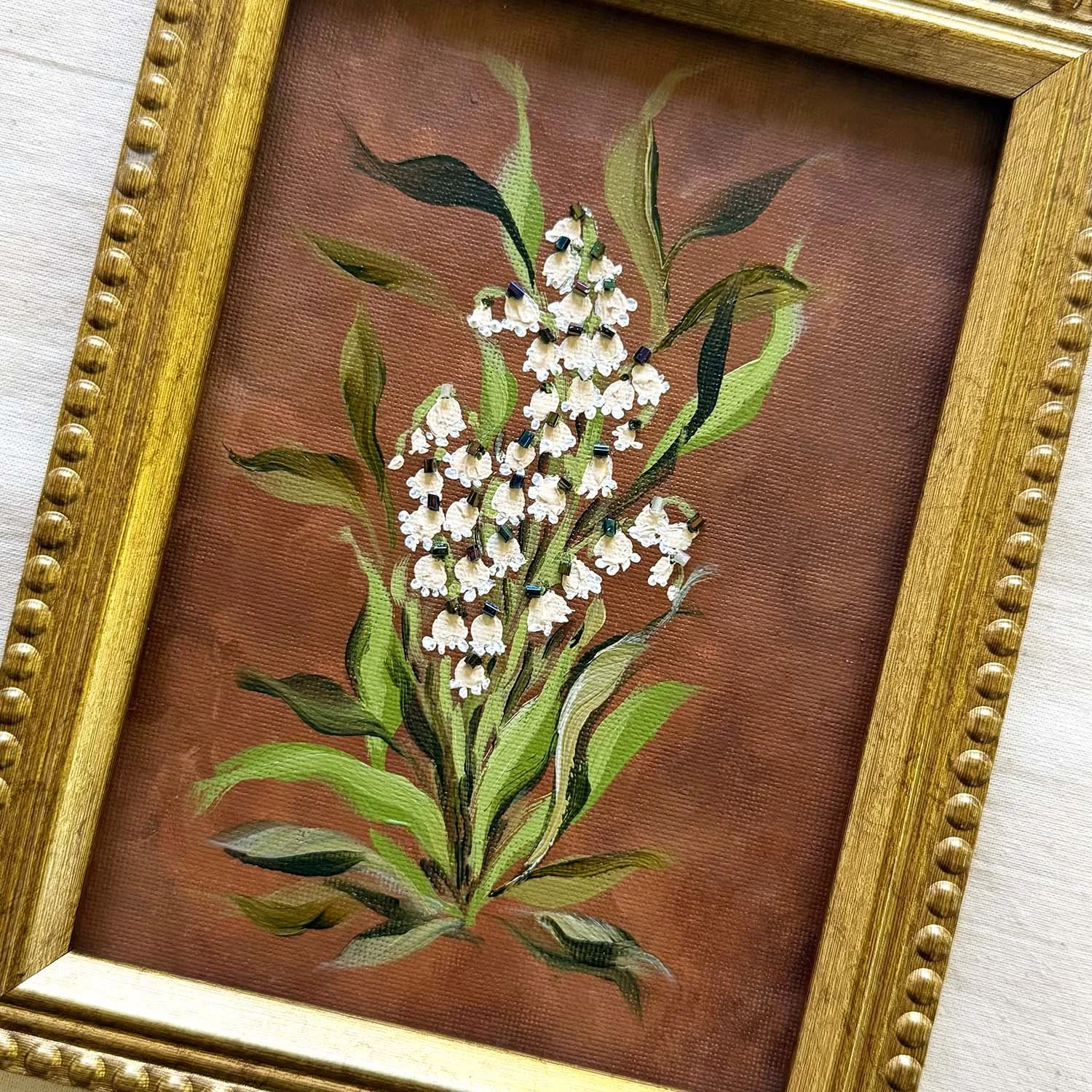 Old World Romantic lily of the valley floral painting with glass bead accents.