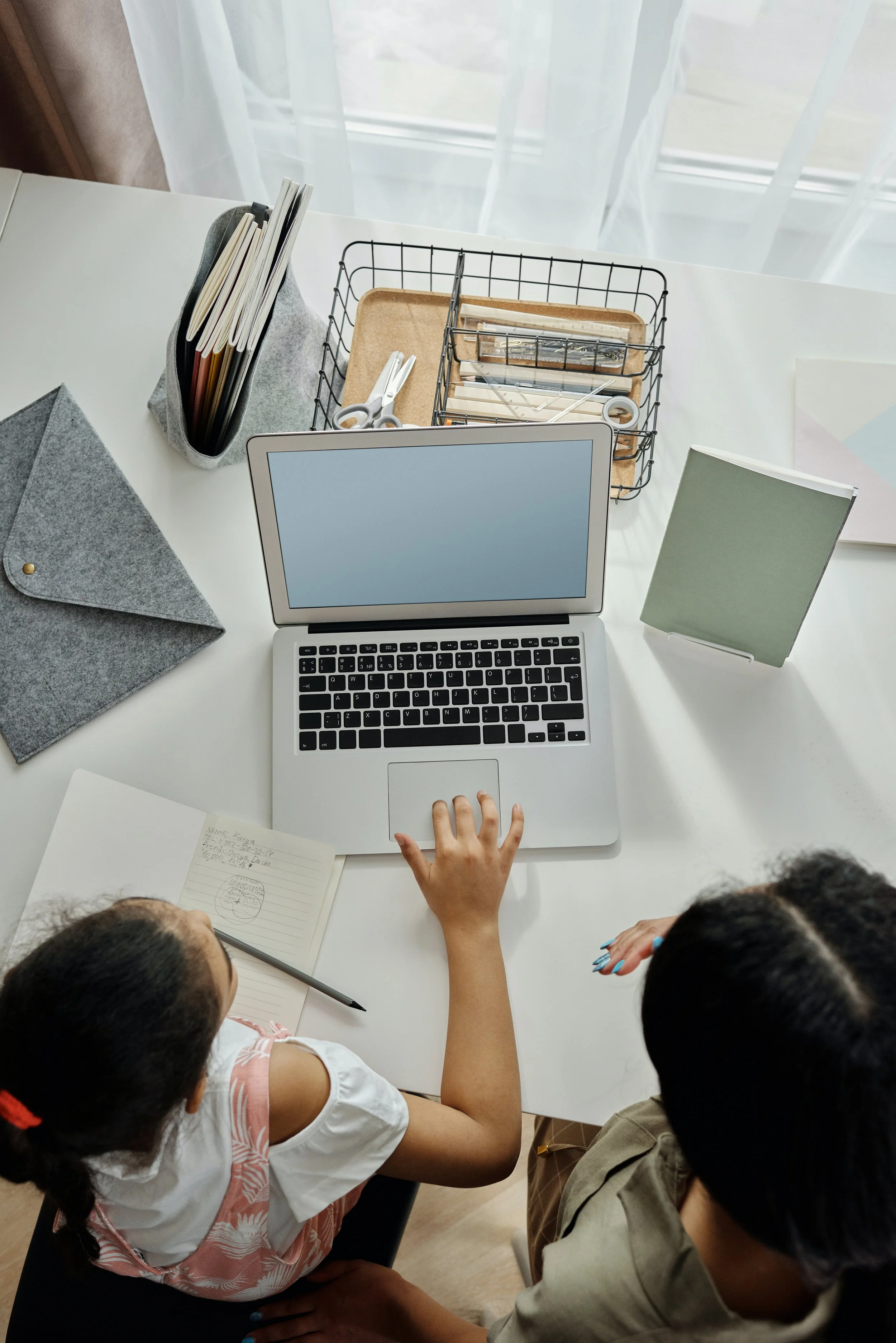 Support Work & Mentoring - Young girl on computer with support worker