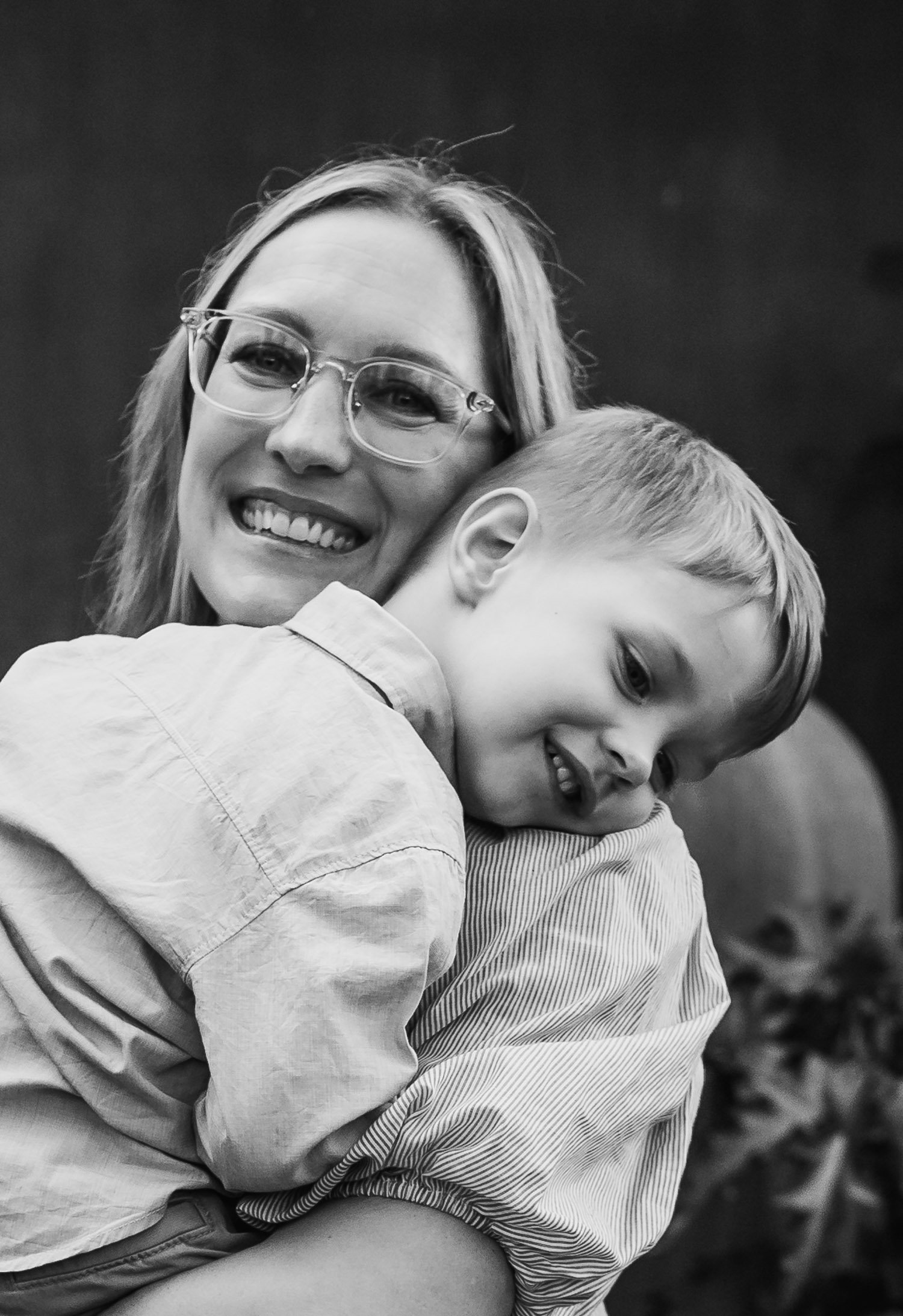 Toddler boy cuddling smiling mum.jpg