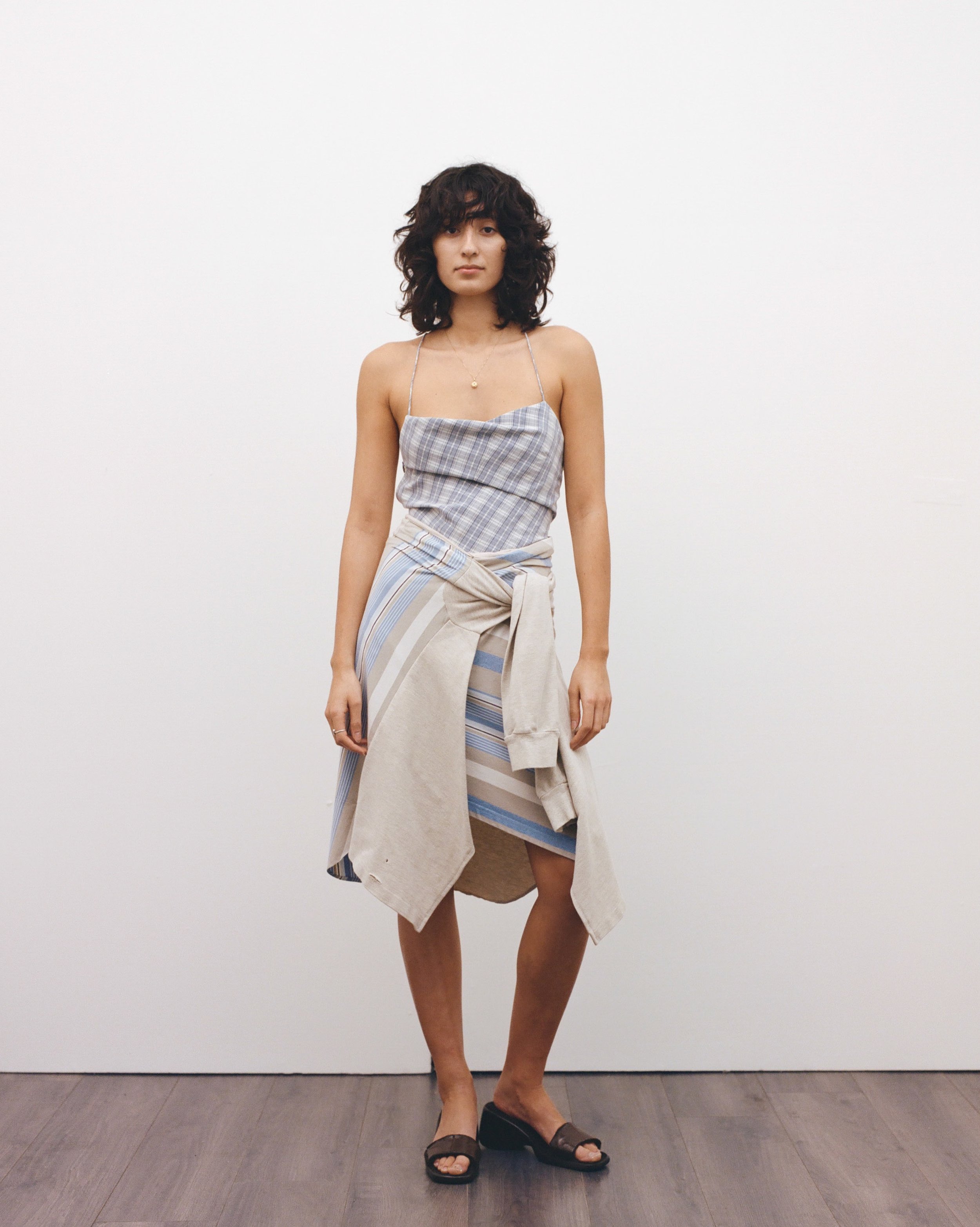Look 9. Justine wears the Up-cycled Crash Top and Polo Skirt, crafted from one repurposed shirt and two polo shirts, sourced from Crisis UK and the Rowcroft Hospice Totnes